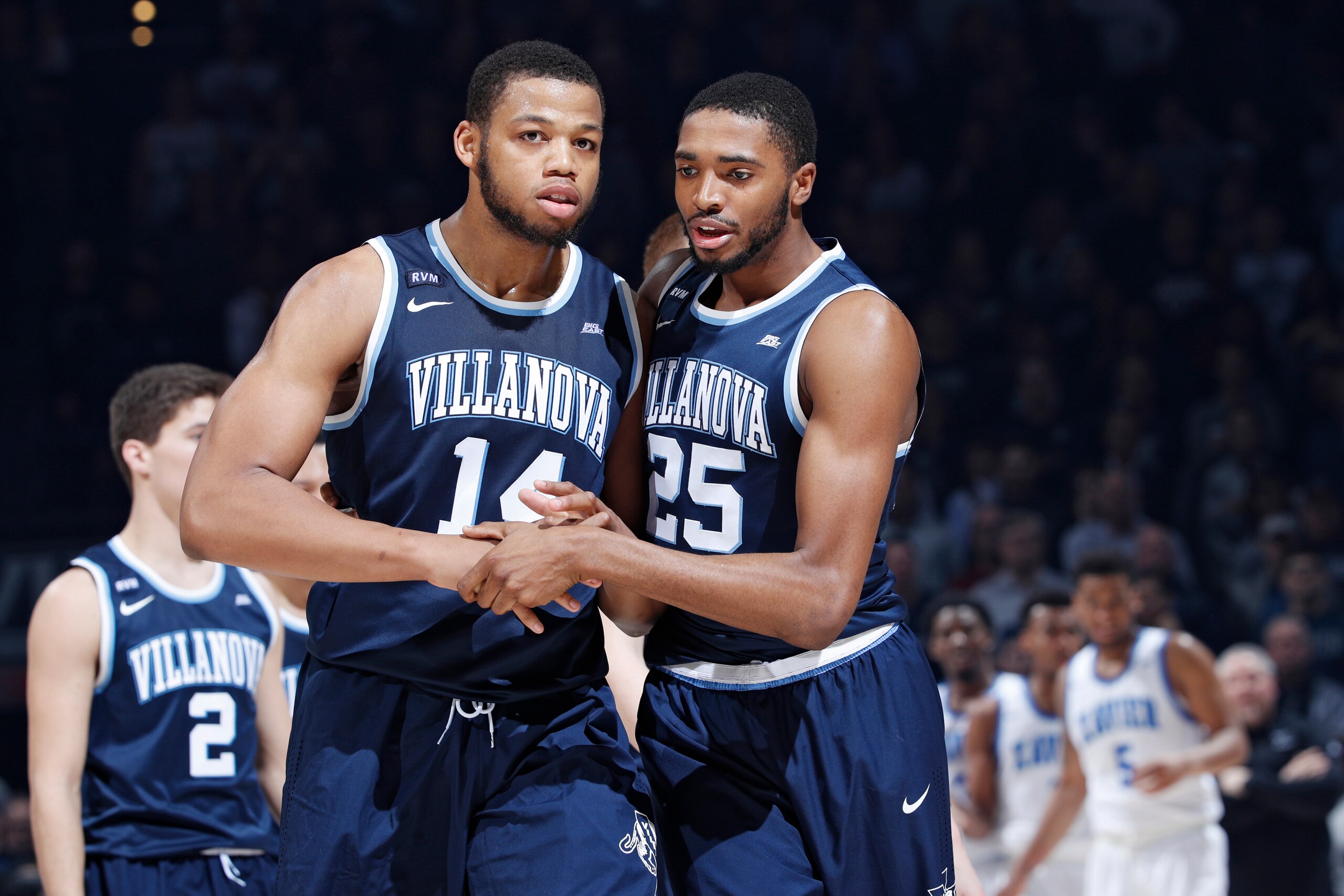CINCINNATI, OH - FEBRUARY 17: Mikal Bridges #25 of the Villanova Wildcats tries to calm down Omari Spellman #14 after a scuffle against the Xavier Musketeers in the second half of a game at Cintas Center on February 17, 2018 in Cincinnati, Ohio. Villanova