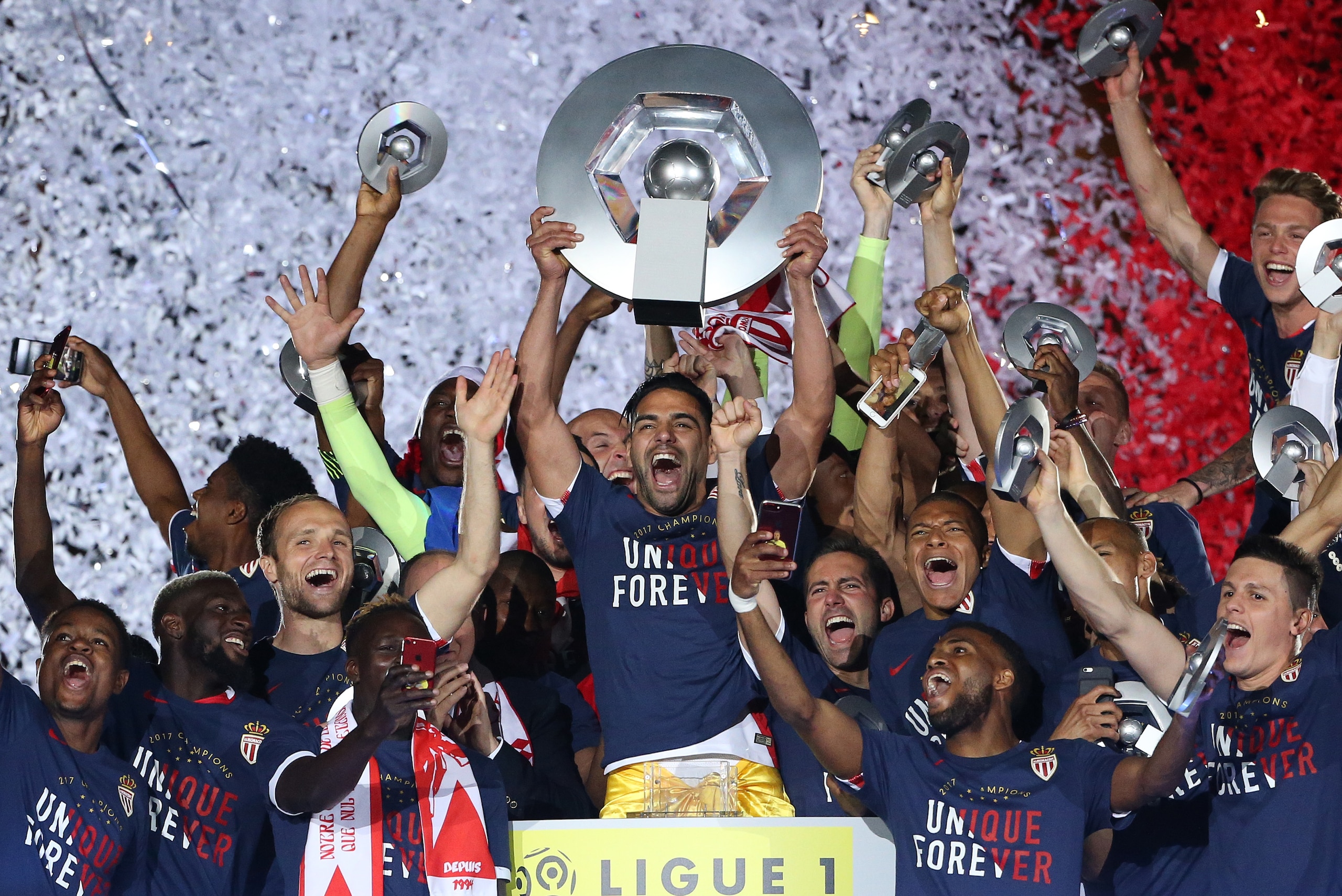 MONACO, MONACO - MAY 17: Captain of AS Monaco Radamel Falcao holding the trophy and teammates during the French League 1 Championship title celebration following the French Ligue 1 match between AS Monaco and AS Saint-Etienne (ASSE) at Stade Louis II on M