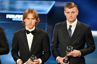 The awardees for the FIFA FIFPro World11 award, (LtoR) Real Madrid and Brazil's defender Marcelo, Real Madrid and Croatia's midfielder Luka Modric and Real Madrid and Germany's midfielder Toni Kroos pose on stage during The Best FIFA Football Awards cerem