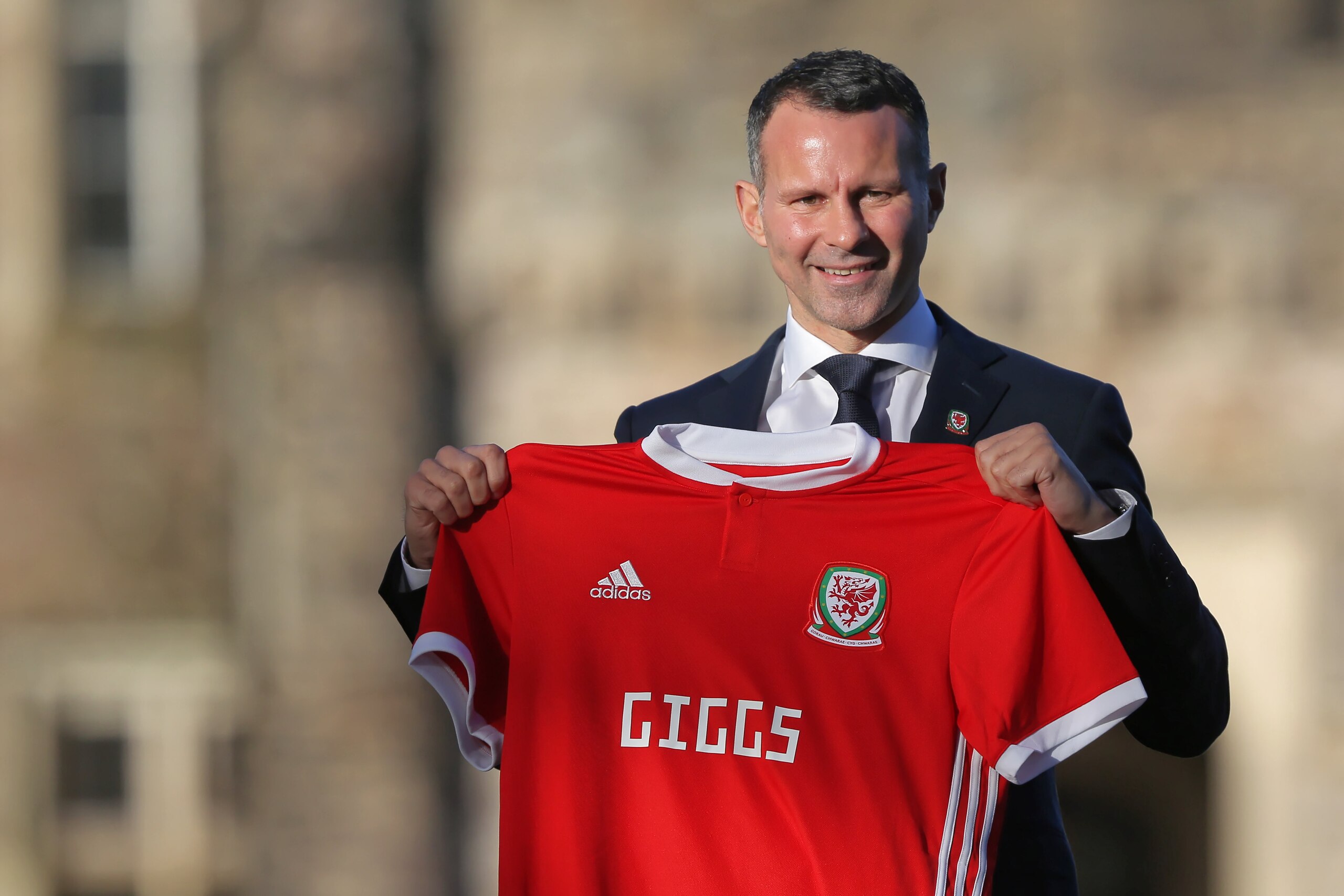CARDIFF, WALES - JANUARY 15: Ryan Giggs poses with a Welsh shirt after attending a press conference as he is announced as the new manager of Wales at Hensol Castle on January 15, 2018 in Cardiff, Wales.  (Photo by Athena Pictures/Getty Images)