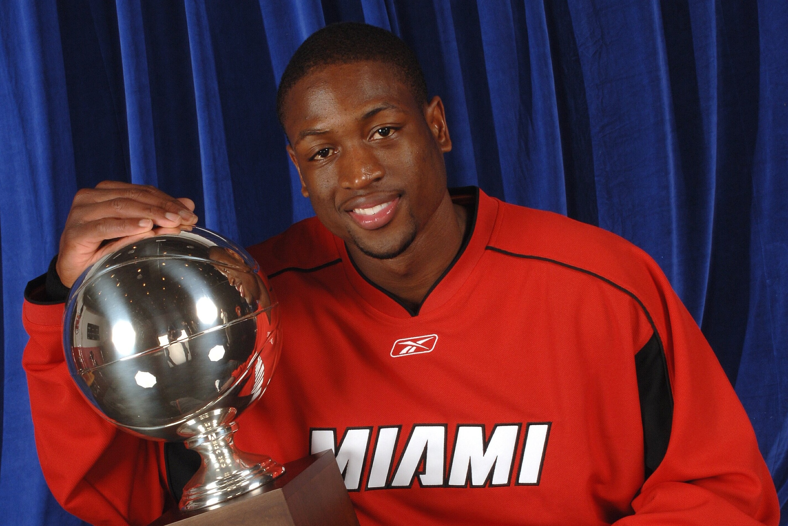 HOUSTON - FEBRUARY 18:  Dwyane Wade #3 of the Miami Heat poses with the trophy for winning the 2006 Playstation Skills Challenge on February 18, 2006 at the Toyota Center in Houston, Texas.  NOTE TO USER: User expressly acknowleges and agrees that, by dow