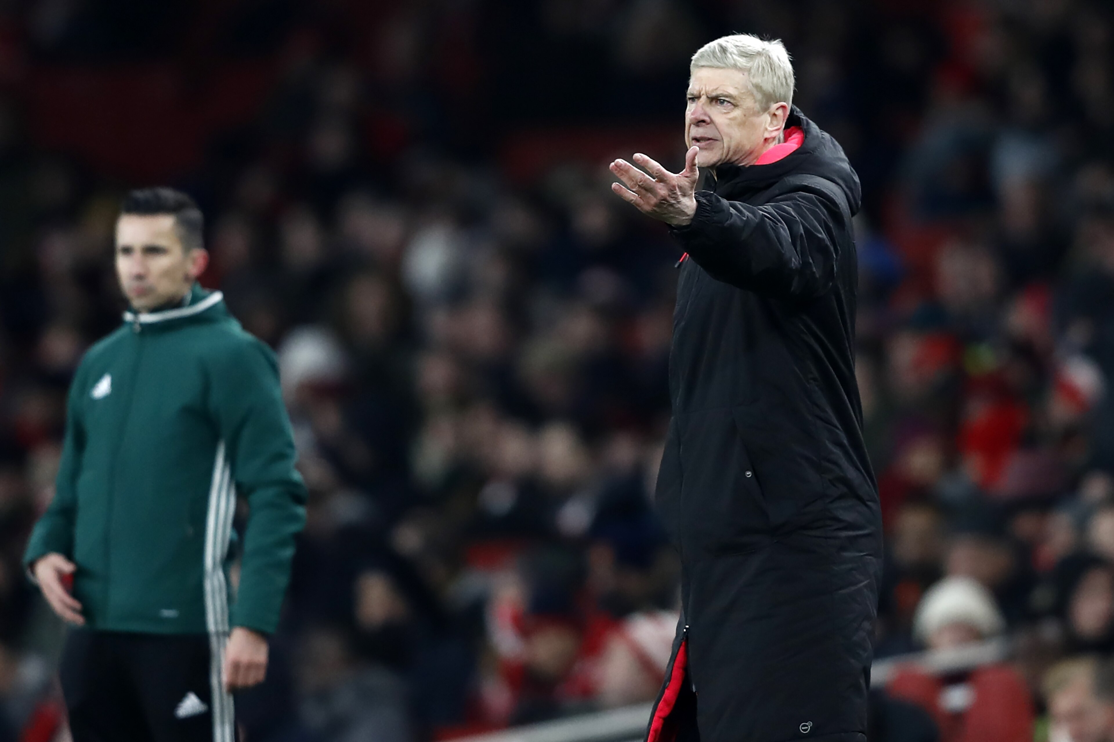 Arsenal's French manager Arsene Wenger gestures on the touchline during the second leg of the Europa League Round of 32 football match between Arsenal and Ostersunds at the Emirates Stadium in London on February 22, 2018. 
Ostersunds won the game 2-1. Ars
