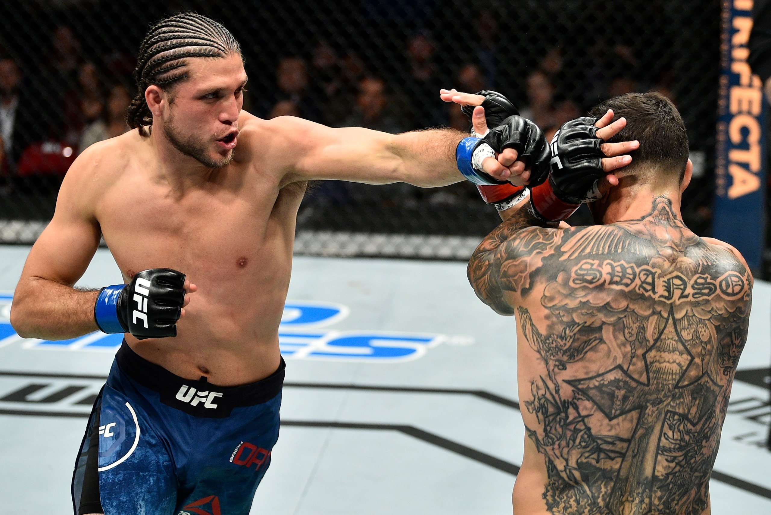FRESNO, CA - DECEMBER 09:  (L-R) Brian Ortega punches Cub Swanson in their featherweight bout during the UFC Fight Night event inside Save Mart Center on December 9, 2017 in Fresno, California. (Photo by Jeff Bottari/Zuffa LLC/Zuffa LLC via Getty Images)