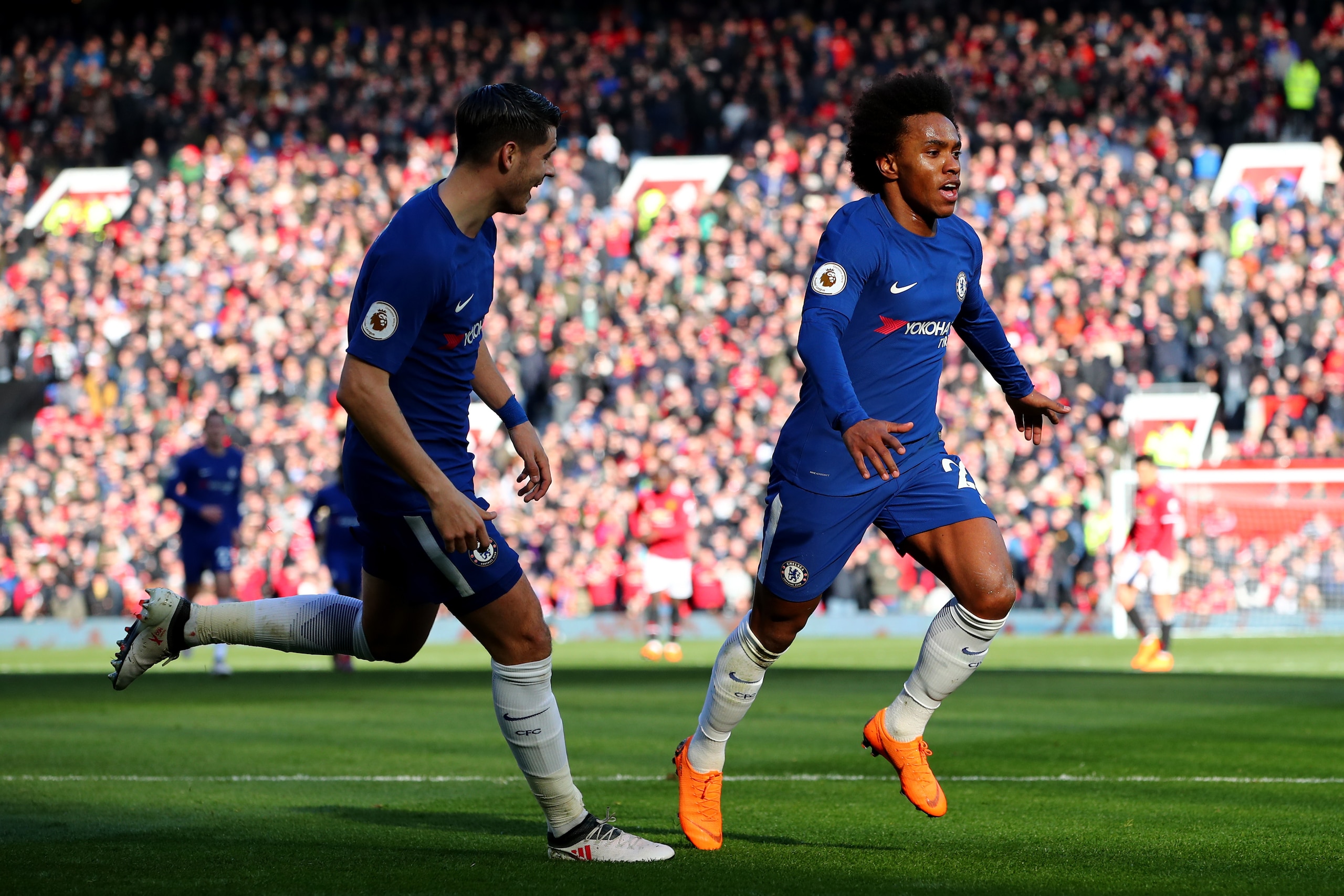 MANCHESTER, ENGLAND - FEBRUARY 25:  Willian of Chelsea celebrates after scoring his sides first goal during the Premier League match between Manchester United and Chelsea at Old Trafford on February 25, 2018 in Manchester, England.  (Photo by Clive Brunsk