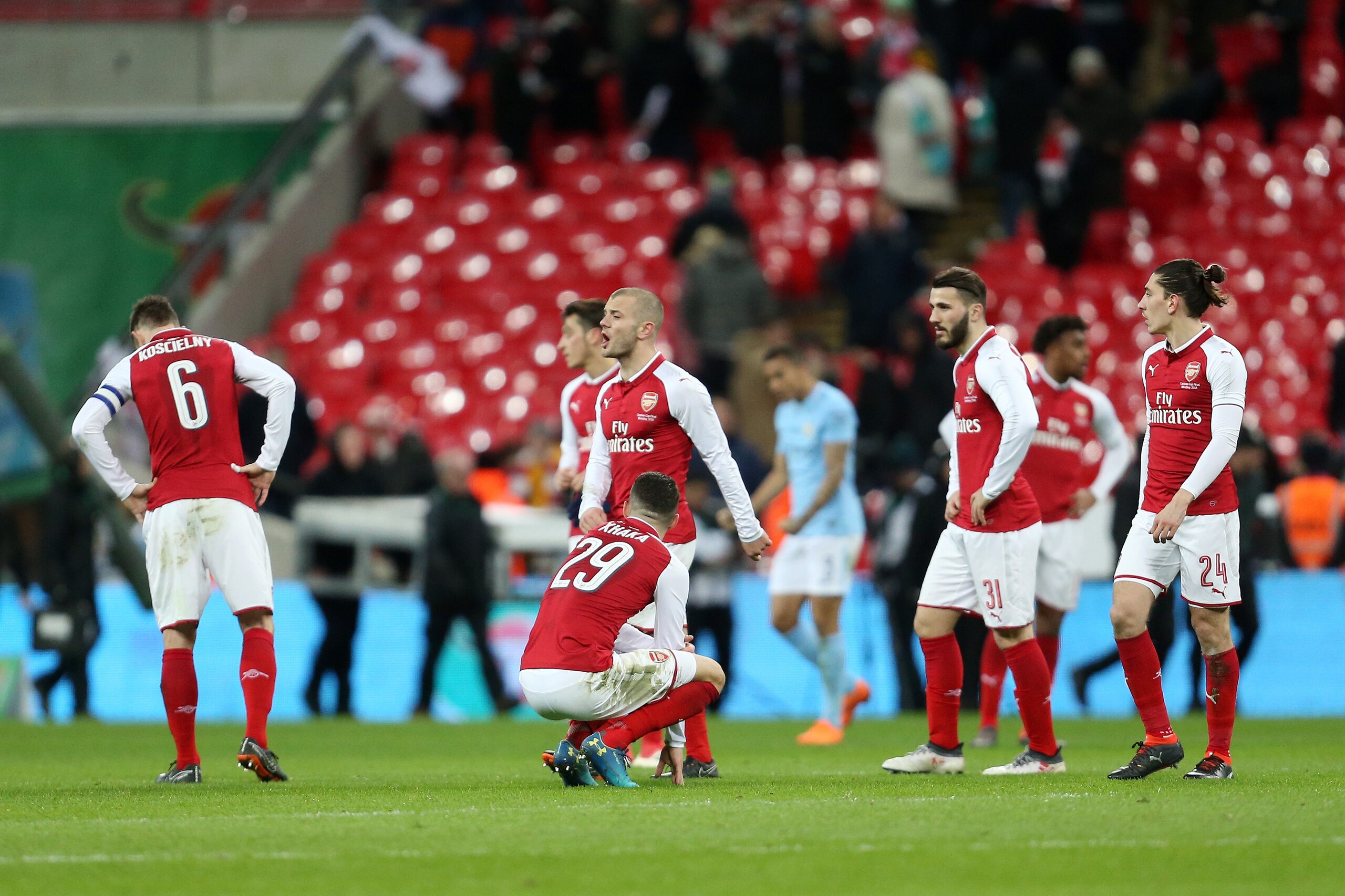 LONDON, ENGLAND - FEBRUARY 25: Dejected Arsenal players react at full time after the Carabao Cup Final match between Arsenal and Manchester City at Wembley Stadium on February 25, 2018 in London, England. (Photo by James Baylis - AMA/Getty Images)