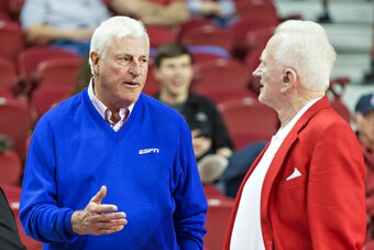 FAYETTEVILLE, AR - FEBRUARY 2:  Bobby Knight and former Athletic Director for the Arkansas Razorbacks Frank Broyles talk before a game against the Tennessee Volunteers at Bud Walton Arena on February 2, 2013 in Fayetteville, Arkansas.  The Razorbacks defe