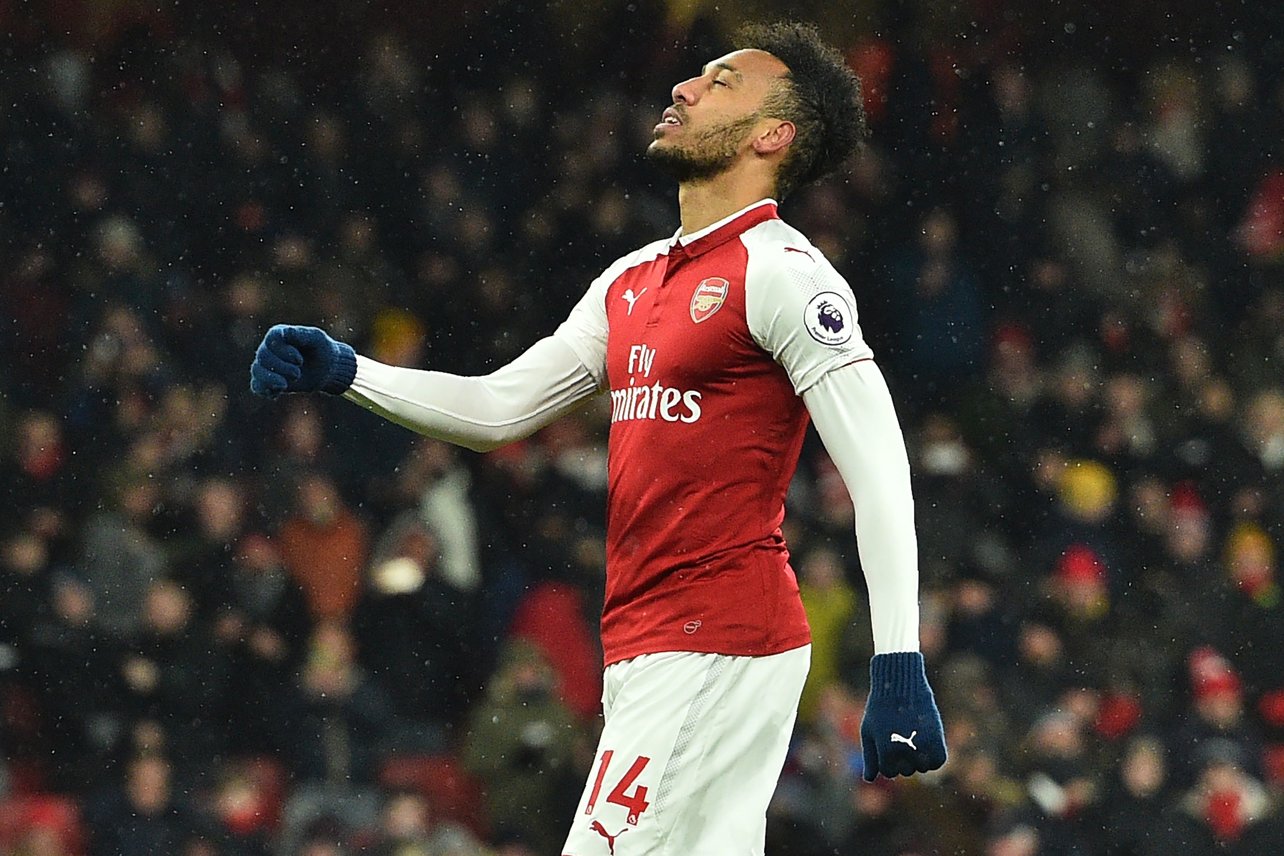 Arsenal's Gabonese striker Pierre-Emerick Aubameyang reacts after having his penalty saved by Manchester City's Brazilian goalkeeper Ederson (not pictured) during the English Premier League football match between Arsenal and Manchester City at the Emirate