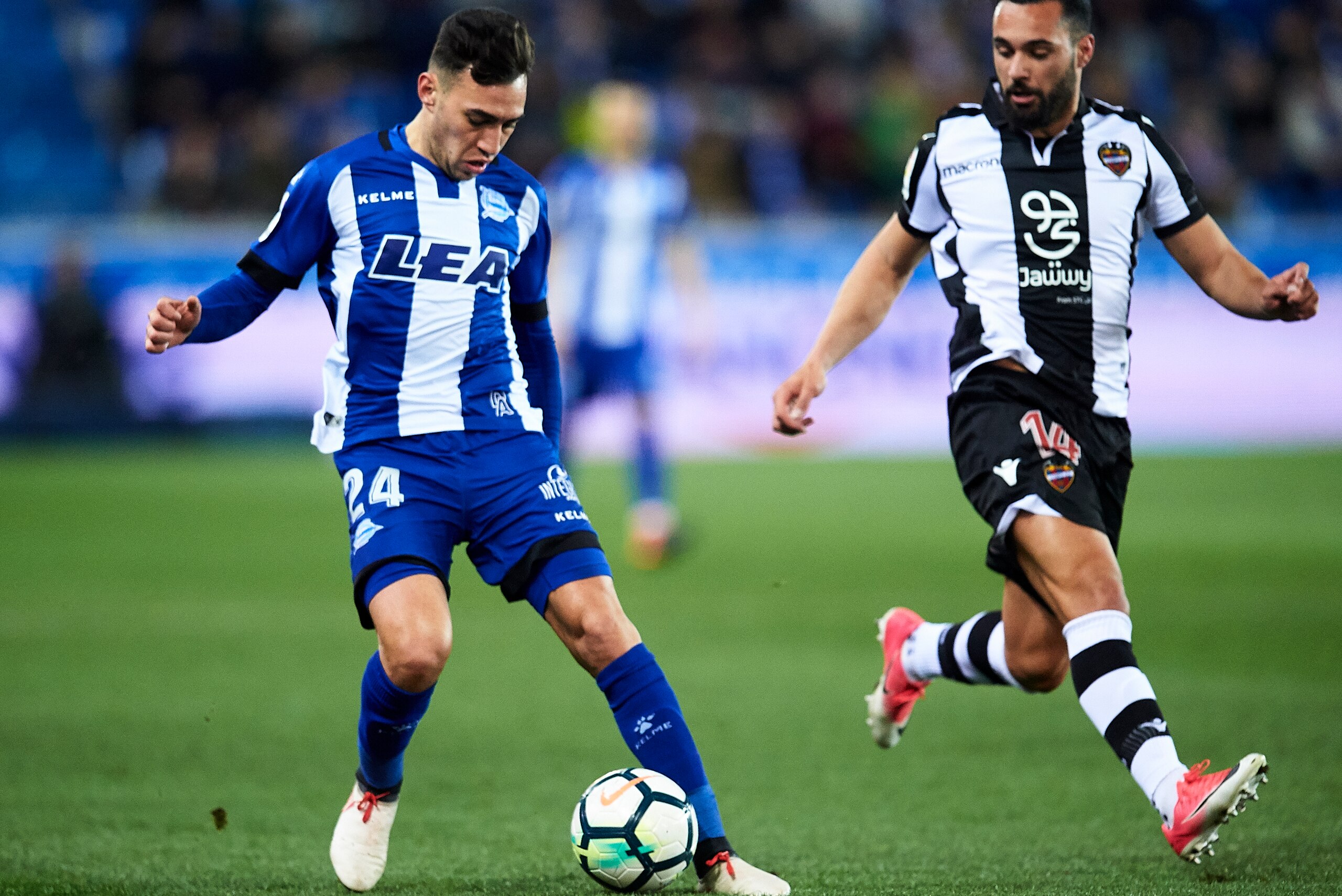 VITORIA-GASTEIZ, SPAIN - MARCH 01: Ivan Lopez 'Ivi' of Levante UD duels for the ball with Munir El Haddadi of Deportivo Alaves during the La Liga match between Deportivo Alaves and Levante UD at Mendizorroza stadium on March 1, 2018 in Vitoria-Gasteiz, S VITORIA-GASTEIZ, SPAIN - MARCH 01: Ivan Lopez 'Ivi' of Levante UD duels for the ball with Munir El Haddadi of Deportivo Alaves during the La Liga match between Deportivo Alaves and Levante UD at Mendizorroza stadium on March 1, 2018 in Vitoria-Gasteiz, S