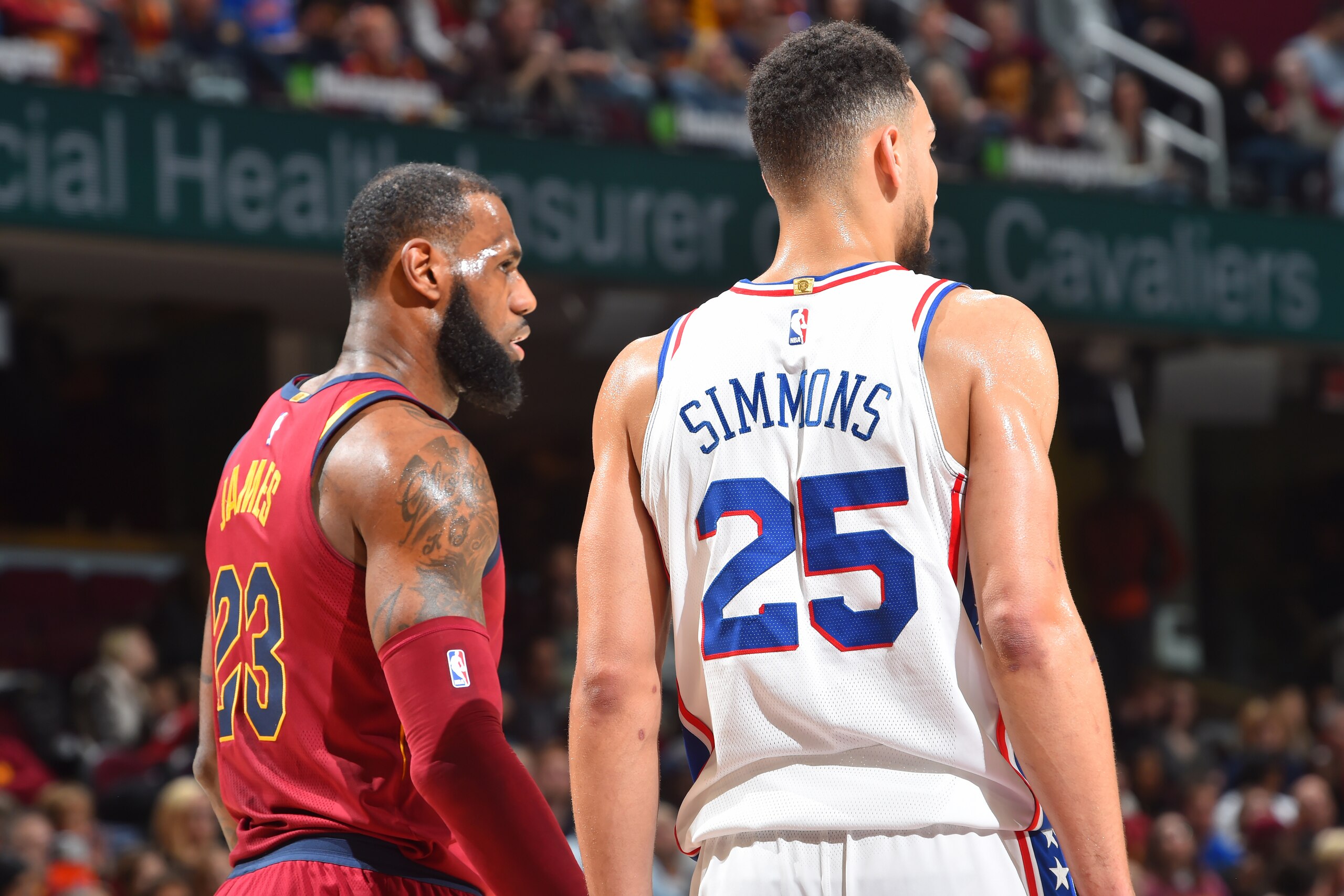 CLEVELAND, OH - DECEMBER 9:  LeBron James #23 of the Cleveland Cavaliers and Ben Simmons #25 of the Philadelphia 76ers are seen on the court during the game on December 9, 2017 at Quicken Loans Arena in Cleveland, Ohio.  NOTE TO USER: User expressly ackno