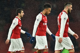 Arsenal's Armenian midfielder Henrikh Mkhitaryan (L), Arsenal's Gabonese striker Pierre-Emerick Aubameyang (C) and Arsenal's German-born Bosnian defender Sead Kolasinac (R) leave the pitch after the English Premier League football match between Arsenal an