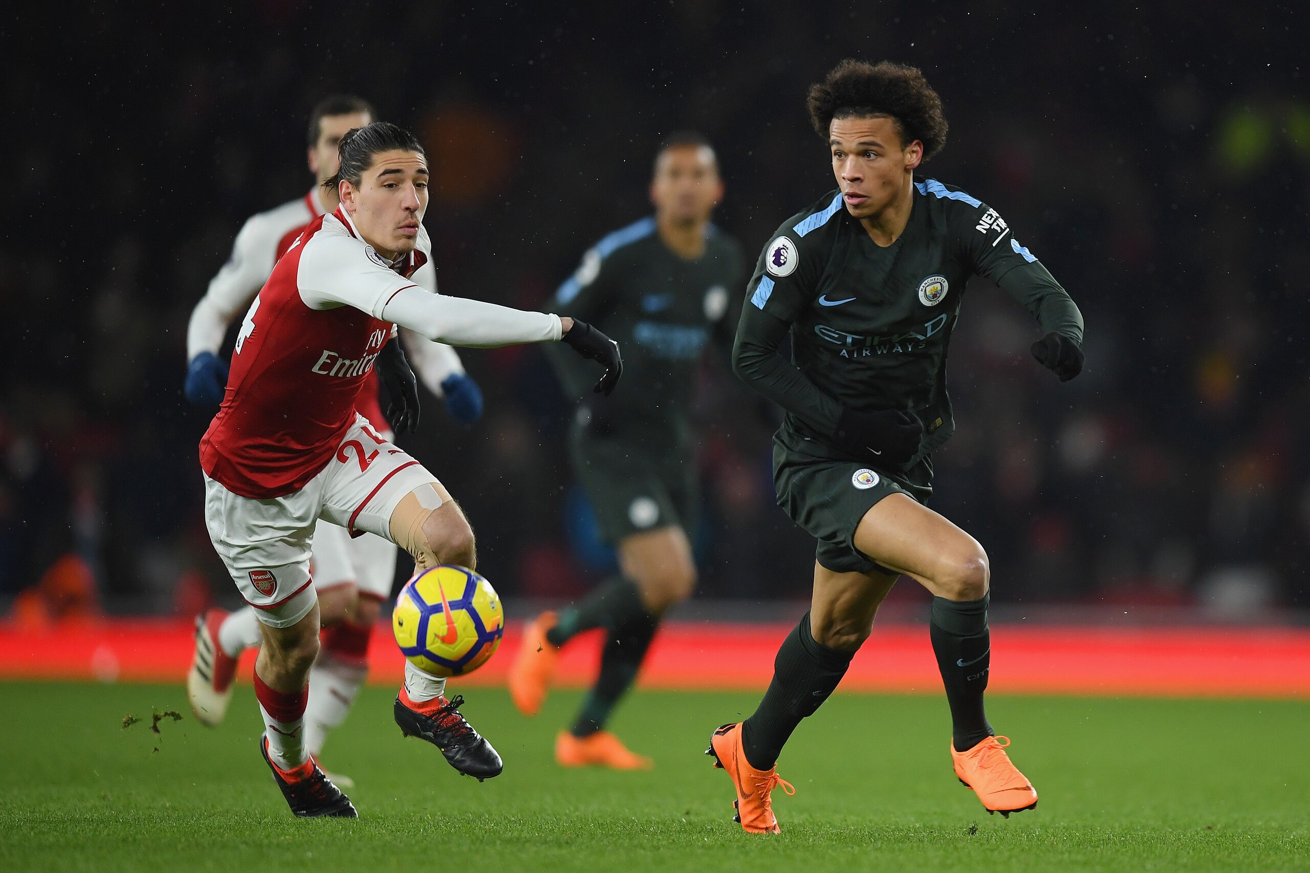 LONDON, ENGLAND - MARCH 01:  Leroy Sane of Manchester City is challenged by Hector Bellerin during the Premier League match between Arsenal and Manchester City at Emirates Stadium on March 1, 2018 in London, England.  (Photo by Mike Hewitt/Getty Images)