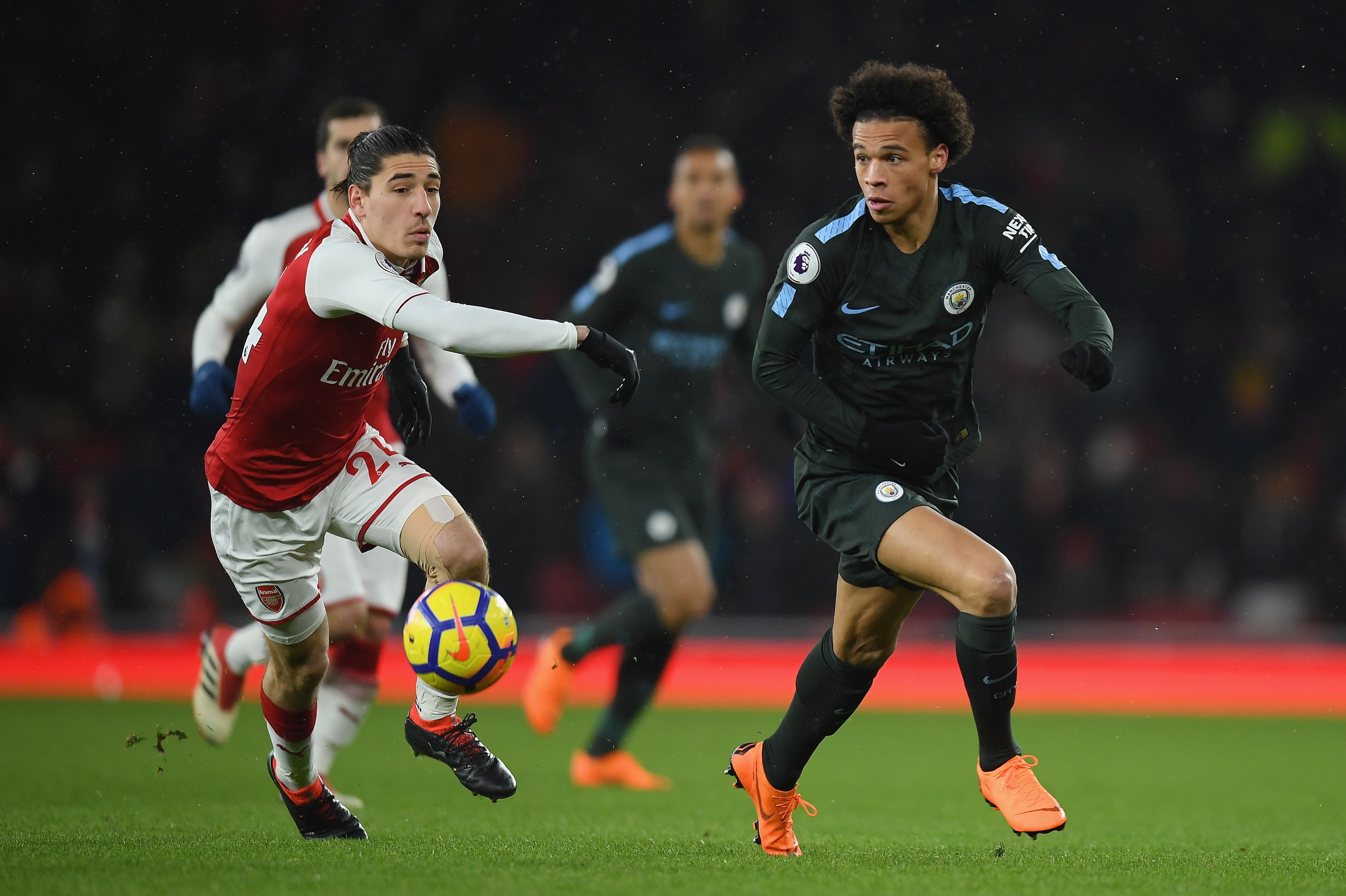 LONDON, ENGLAND - MARCH 01:  Leroy Sane of Manchester City is challenged by Hector Bellerin during the Premier League match between Arsenal and Manchester City at Emirates Stadium on March 1, 2018 in London, England.  (Photo by Mike Hewitt/Getty Images)