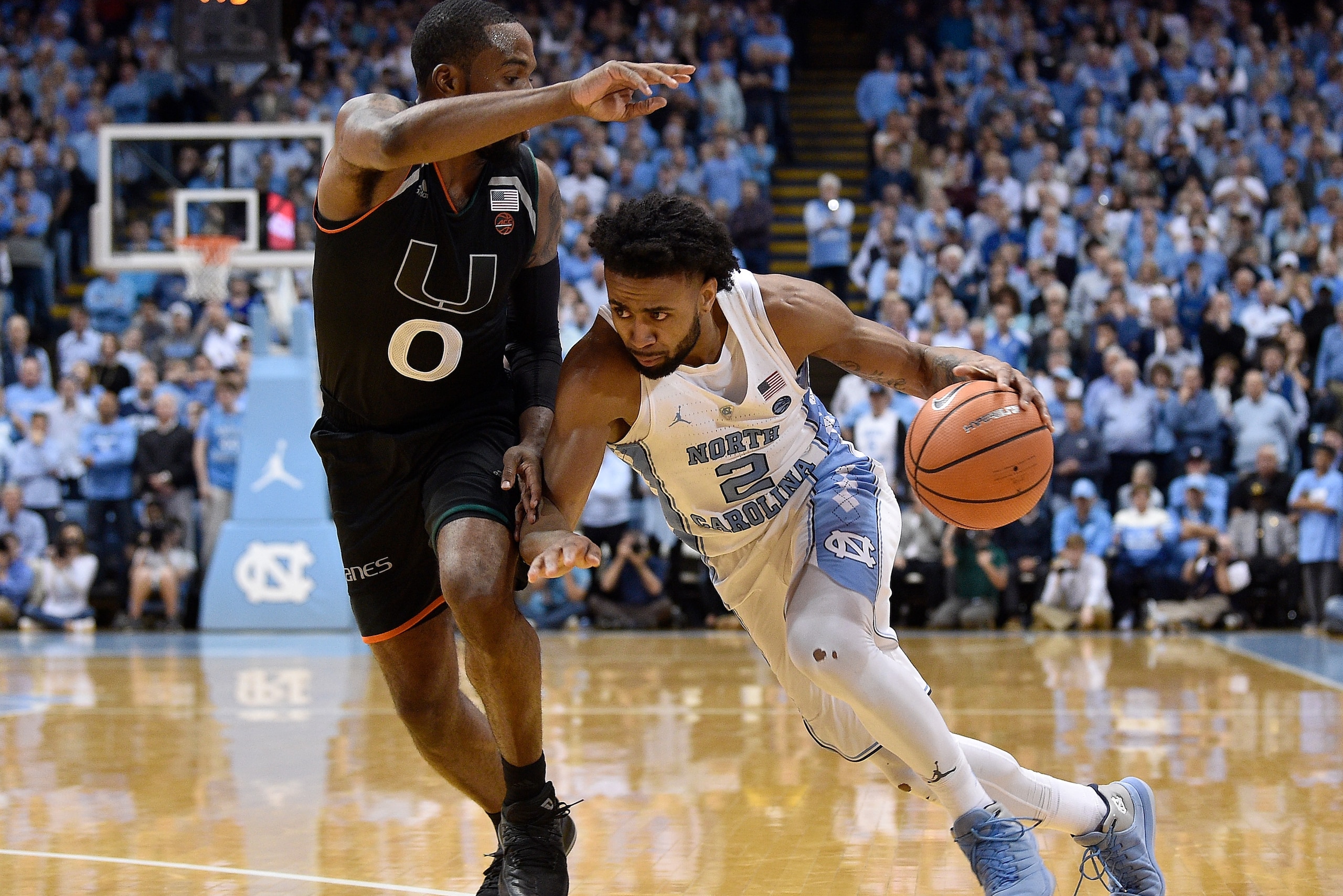 CHAPEL HILL, NC - FEBRUARY 27:  Joel Berry II #2 of the North Carolina Tar Heels drives against Ja'Quan Newton #0 of the Miami Hurricanes during their game at the Dean Smith Center on February 27, 2018 in Chapel Hill, North Carolina. Miami won 91-88.  (Ph