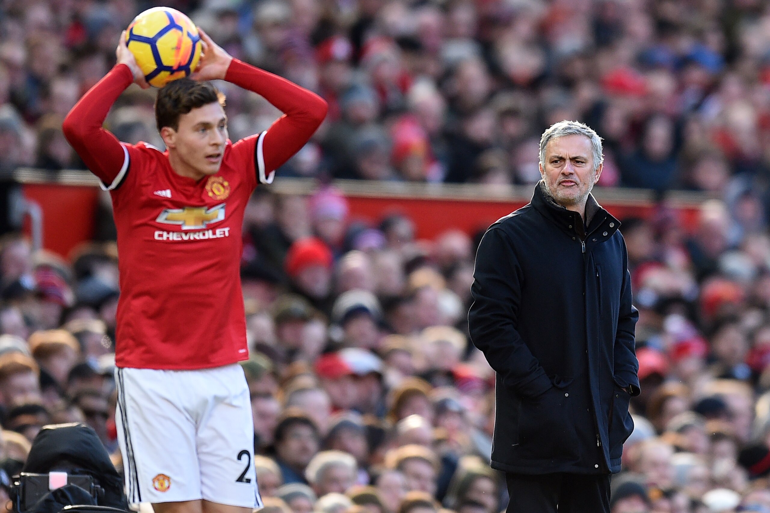 Manchester United's Portuguese manager Jose Mourinho watches as Manchester United's Swedish defender Victor Lindelof takes a throw-in during the English Premier League football match between Manchester United and Chelsea at Old Trafford in Manchester, nor