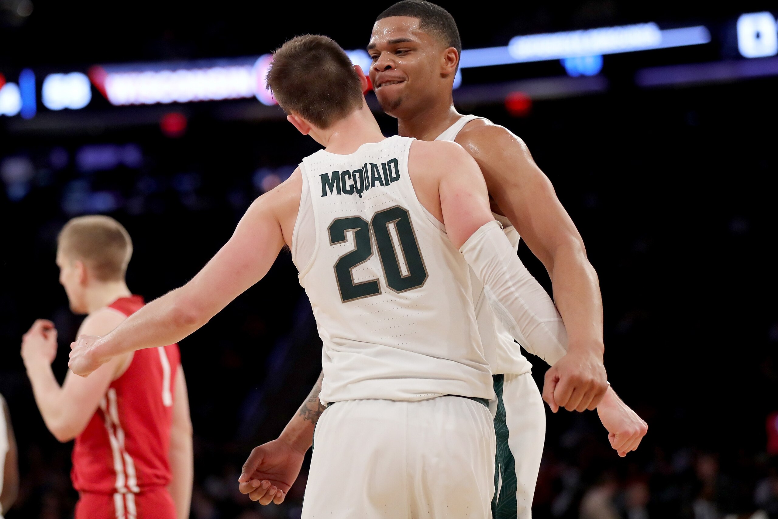 NEW YORK, NY - MARCH 02:  Miles Bridges #22 congratulates teammate Matt McQuaid #20 of the Michigan State Spartans after a shot in the second half against the Wisconsin Badgers during quarterfinals of the Big Ten Basketball Tournament at Madison Square Ga