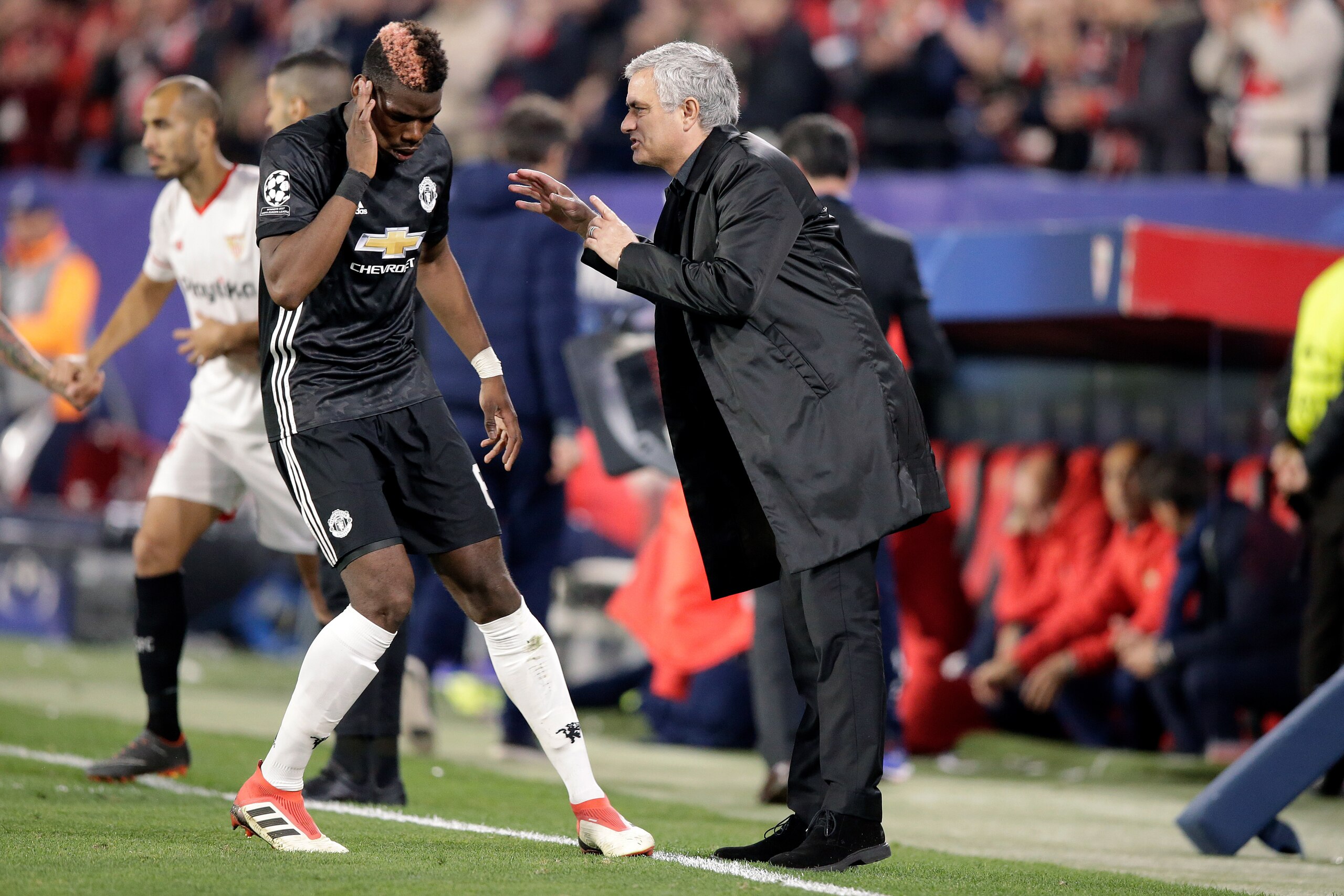 SEVILLA, SPAIN - FEBRUARY 21: (L-R) Paul Pogba of Manchester United, coach Jose Mourinho of Manchester United  during the UEFA Champions League  match between Sevilla v Manchester United at the Estadio Ramon Sanchez Pizjuan on February 21, 2018 in Sevilla