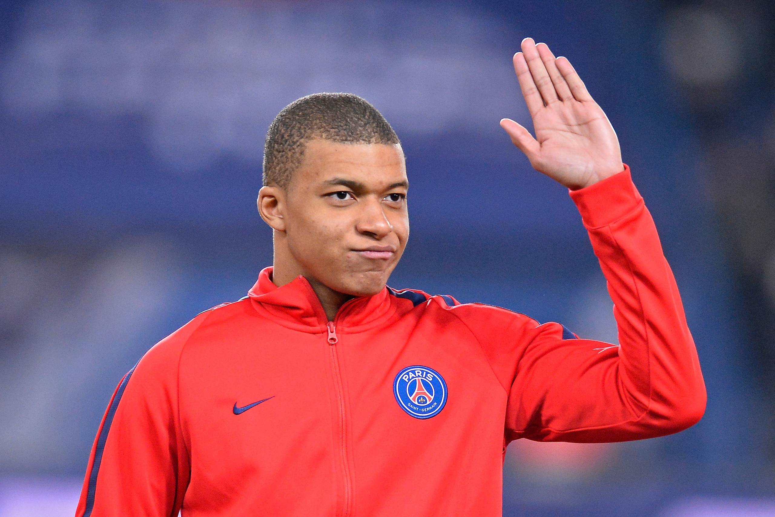 PARIS, FRANCE - FEBRUARY 28:  Kylian Mbappe of Paris Saint-Germain reacts during the teams presentation before the French Cup match between Paris Saint-Germain and Olympique de Marseille at Parc des Princes on February 28, 2018 in Paris, France.  (Photo b