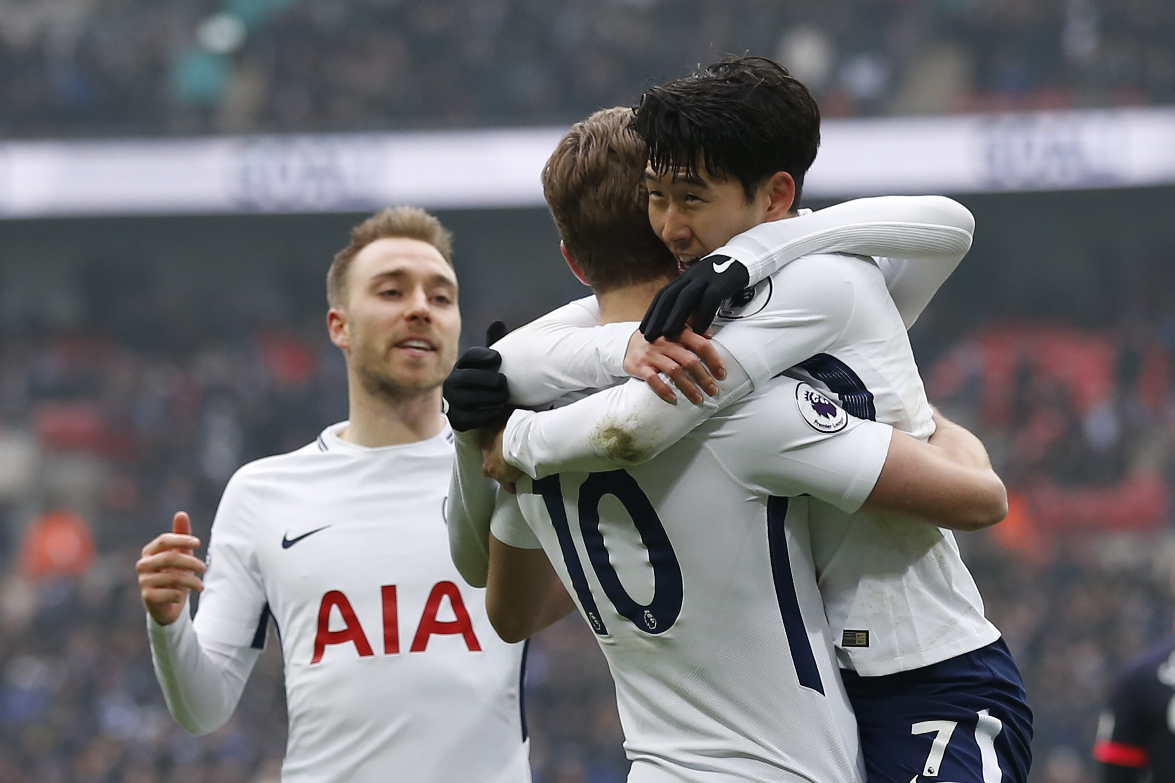 Tottenham Hotspur's South Korean striker Son Heung-Min (R) celebrates with Tottenham Hotspur's English striker Harry Kane (C) and Tottenham Hotspur's Danish midfielder Christian Eriksen, after scoring the team's second goal during the English Premier Leag