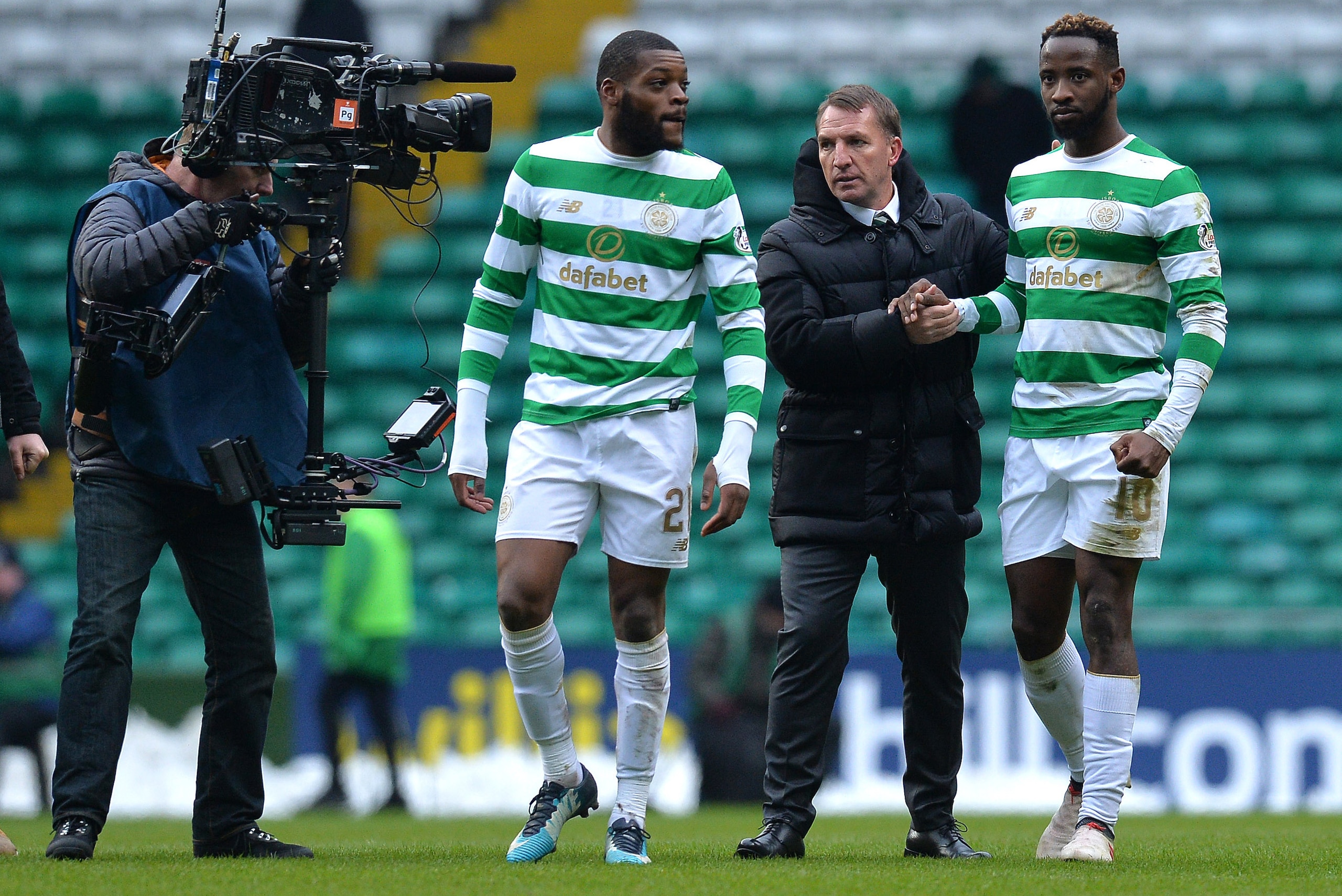 GLASGOW, SCOTLAND - MARCH 03: Celtic manager Brendan Rodgers congratulates goal scorer Moussa Dembele at the final whistle after his two goals during the Scottish Cup Quarter Final match between Celtic and Greenock Morton at Celtic Park on March 3, 2018 i