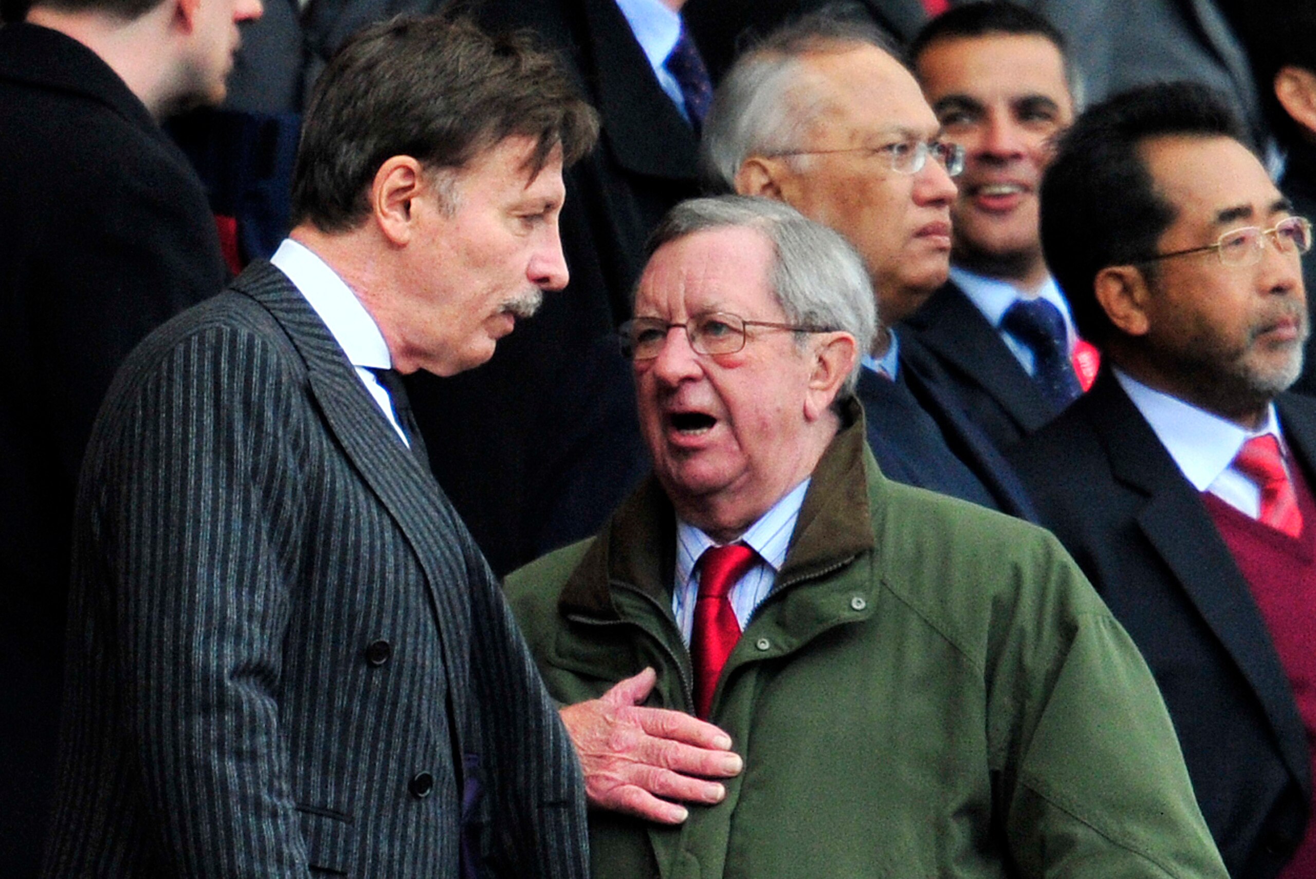 Arsenal's US majority shareholder Stan Kroenke (L) talks to Chairman Peter Hill-Wood (R) before the English Premier League football match between Arsenal and Queens Park Rangers at The Emirates Stadium in north London, England on October 27, 2012. Arsenal