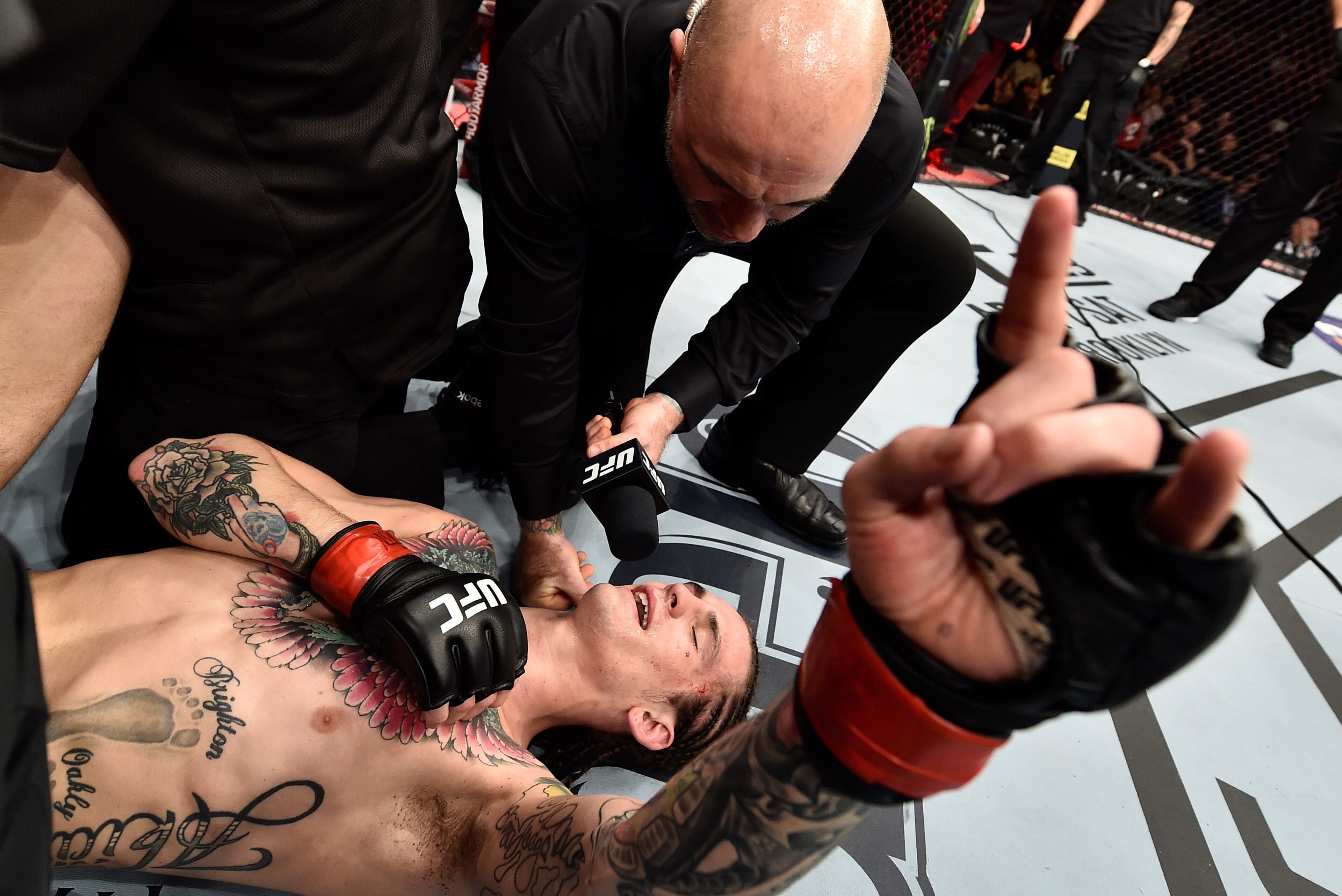 LAS VEGAS, NV - MARCH 03:   Sean O'Malley is interviewed by Joe Rogan after his unanimous-decision victory over Andre Soukhamthath in their bantamweight bout during the UFC 222 event inside T-Mobile Arena on March 3, 2018 in Las Vegas, Nevada. (Photo by J