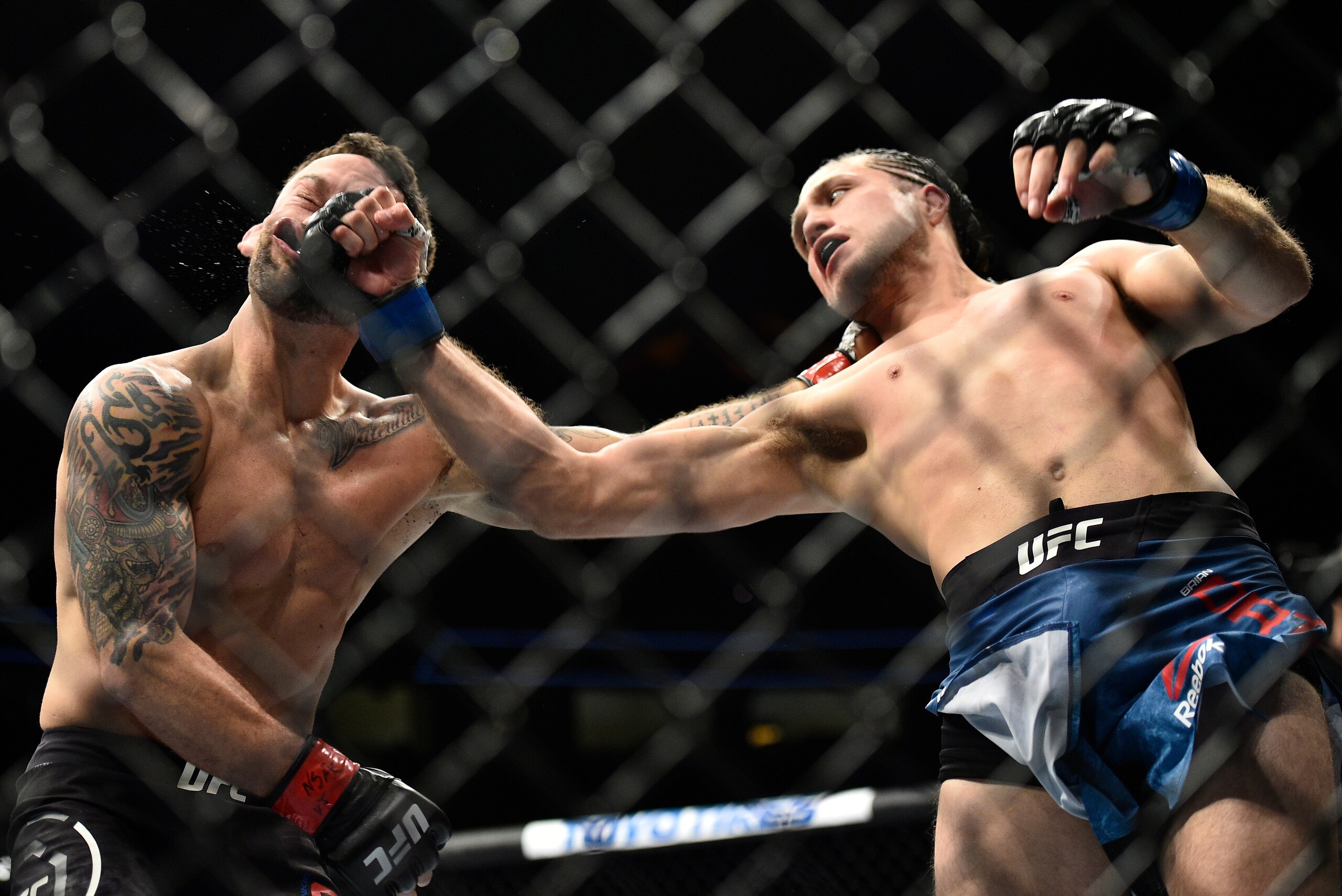 LAS VEGAS, NV - MARCH 03:   (R-L) Brian Ortega knocks out Frankie Edgar in their featherweight bout during the UFC 222 event inside T-Mobile Arena on March 3, 2018 in Las Vegas, Nevada. (Photo by Brandon Magnus/Zuffa LLC/Zuffa LLC via Getty Images)