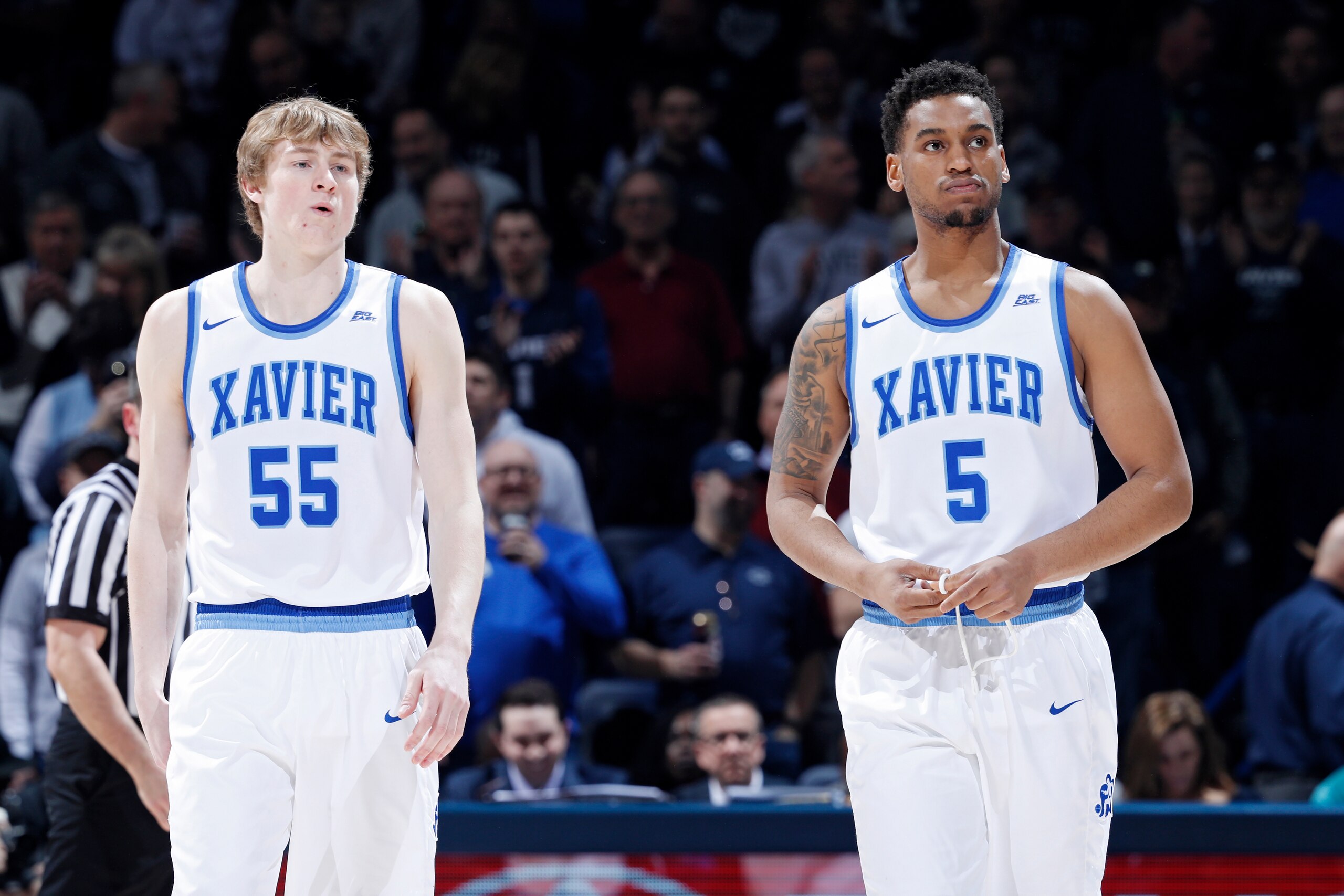 CINCINNATI, OH - FEBRUARY 17: Trevon Bluiett #5 and J.P. Macura #55 of the Xavier Musketeers look on during a game against the Villanova Wildcats at Cintas Center on February 17, 2018 in Cincinnati, Ohio. Villanova won 95-79. (Photo by Joe Robbins/Getty I