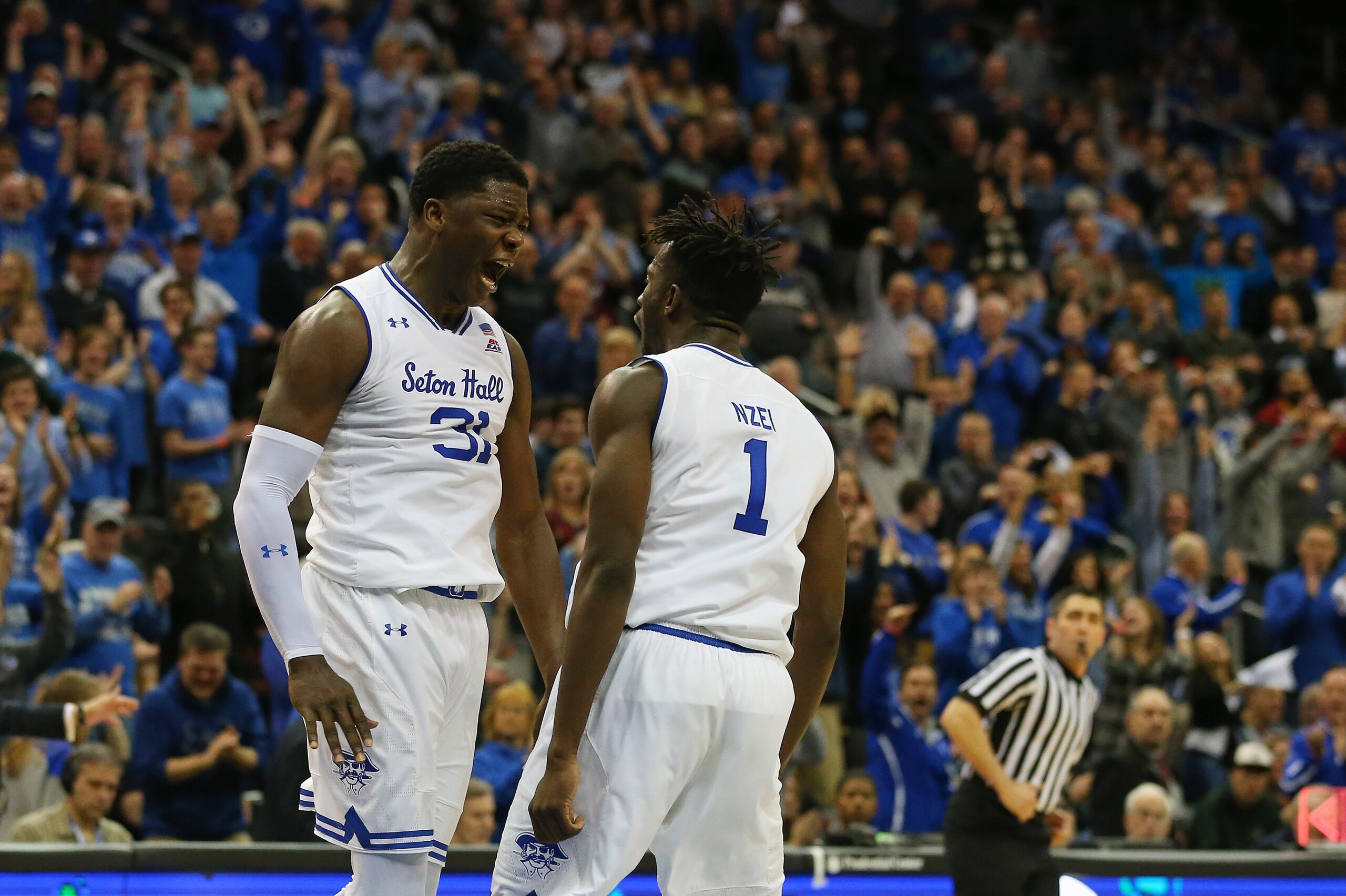NEWARK, NJ - MARCH 03: Angel Delgado #31 of the Seton Hall Pirates celebrates with Michael Nzei #1 after Nzei's dunk against the Butler Bulldogs during the second half of a game at Prudential Center on March 3, 2018 in Newark, New Jersey. Seton Hall defea