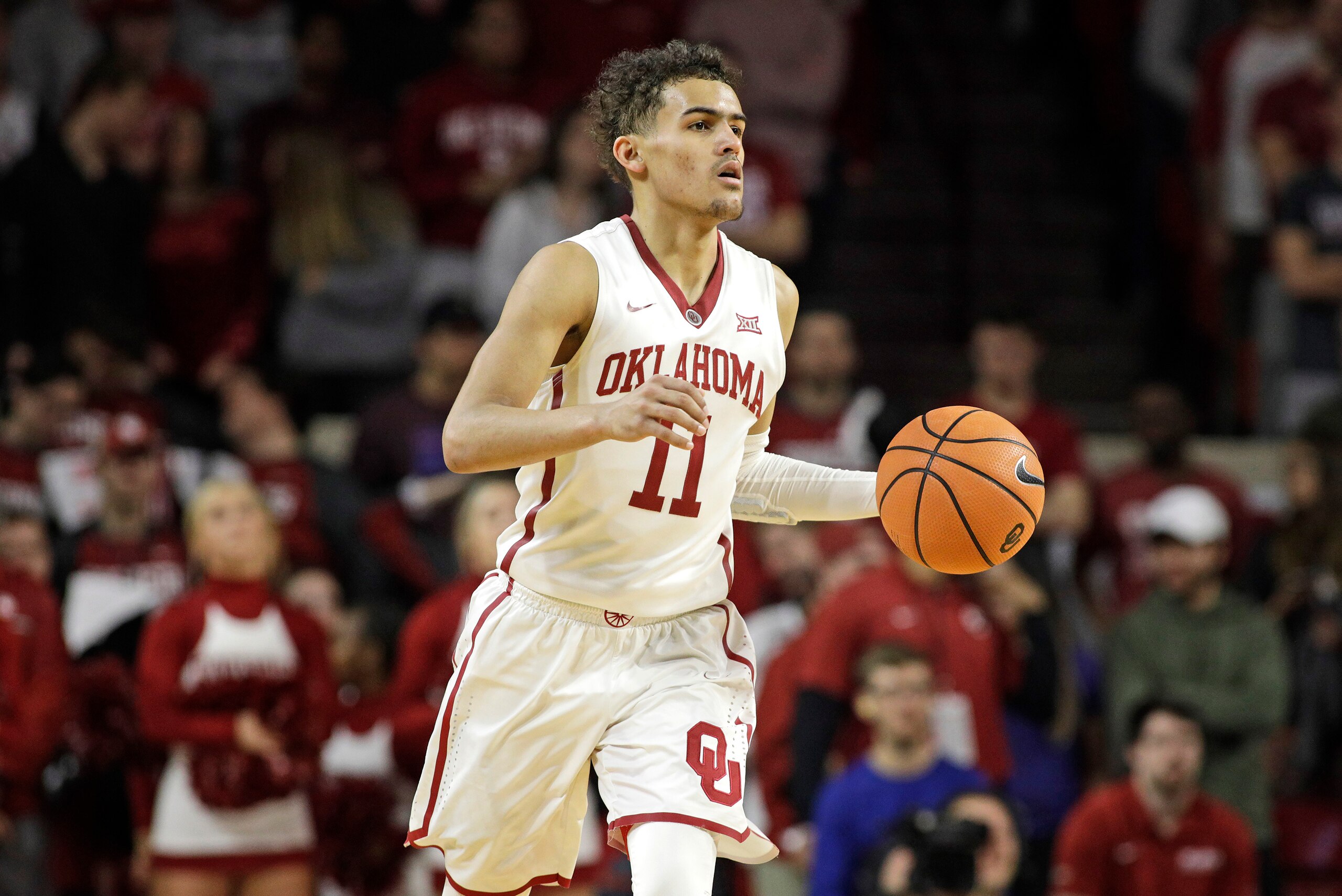 NORMAN, OK - FEBRUARY 17: Trae Young #11 of the Oklahoma Sooners dribbles down court during the game against the Texas Longhorns at Lloyd Noble Center on February 24, 2018 in Norman, Oklahoma. The Longhorns defeated the Sooners 77-66. (Photo by Brett Deer