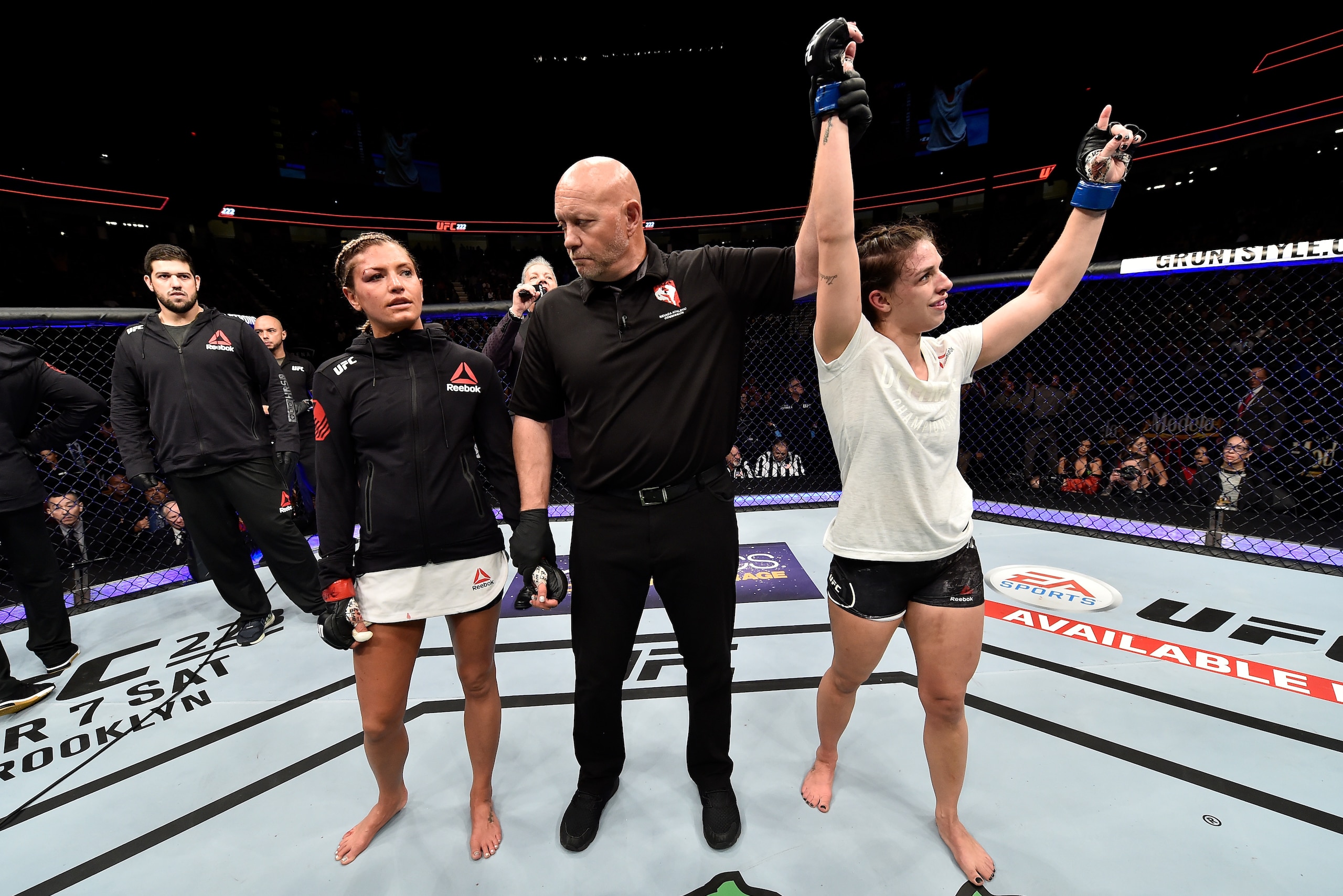 LAS VEGAS, NV - MARCH 03:   Mackenzie Dern celebrates after her split-decision victory over Ashley Yoder in their women's strawweight bout during the UFC 222 event inside T-Mobile Arena on March 3, 2018 in Las Vegas, Nevada. (Photo by Jeff Bottari/Zuffa L