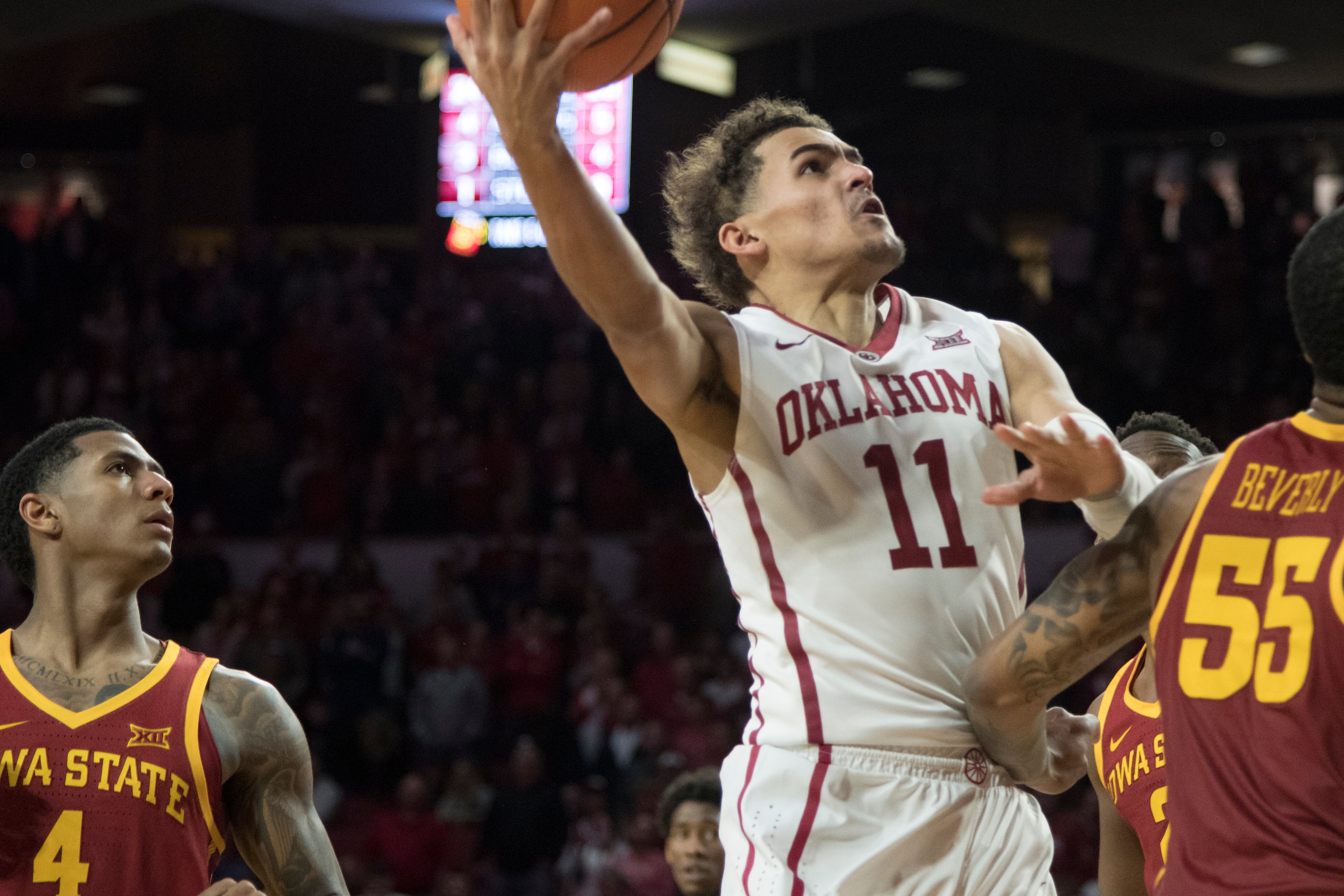 NORMAN, OK - MARCH 2: Oklahoma Sooners guard Trae Young #11 shoots over an Iowa State player during the second half of a NCAA college basketball game at the Lloyd Noble Center on March 2, 2018 in Norman, Oklahoma. (Photo by J Pat Carter/Getty Images)