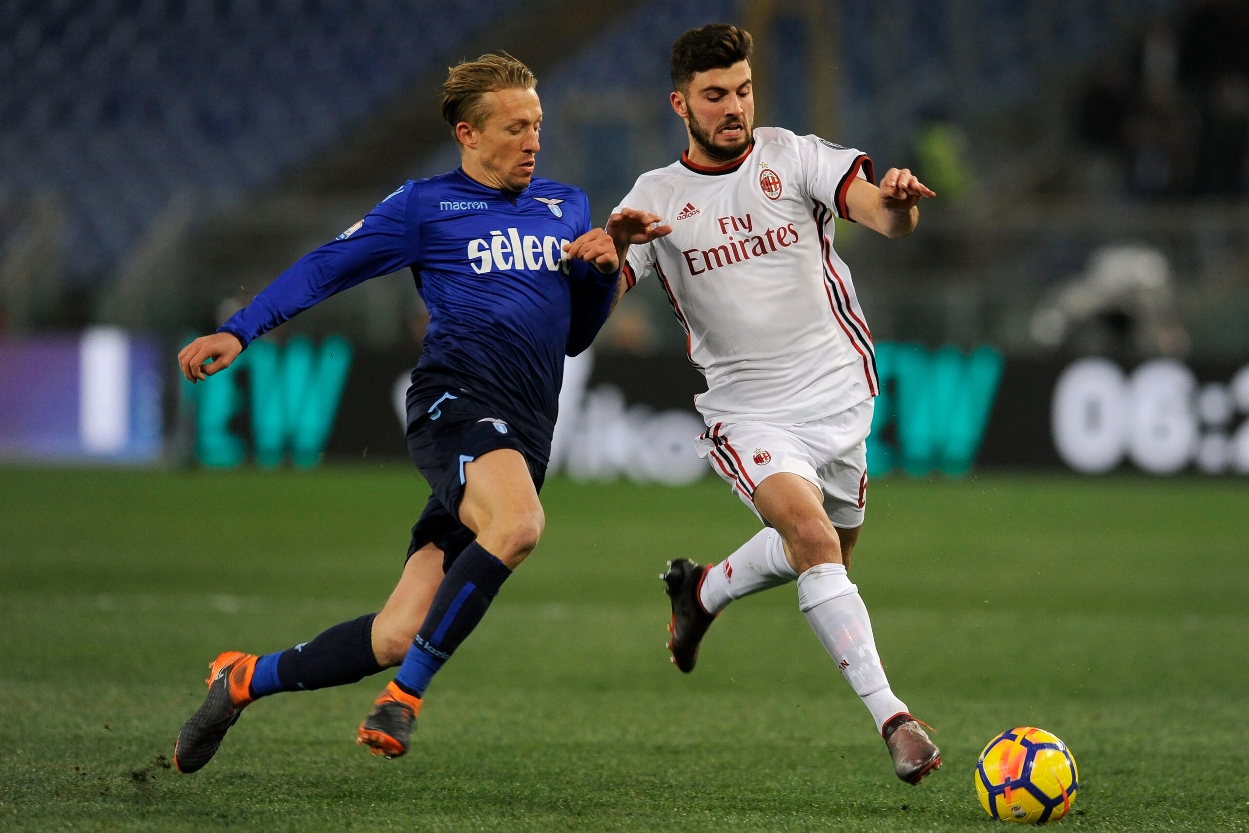 ROME, ROMA - FEBRUARY 28:  Lucas Leiva of SS Lazio compete for the ball with Patrick Cutrone of AC Milan during the TIM Cup match between SS Lazio and AC Milan at Olimpico Stadium on February 28, 2018 in Rome, Italy.  (Photo by Marco Rosi/Getty Images)