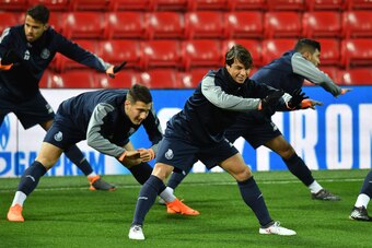 Porto's Spanish midfielder Oliver Torres (R) and teammates participate in a training session prior to the UEFA Champions League round of sixteen second leg football match between Liverpool and FC Porto at Anfield in Liverpool, north west England on March 