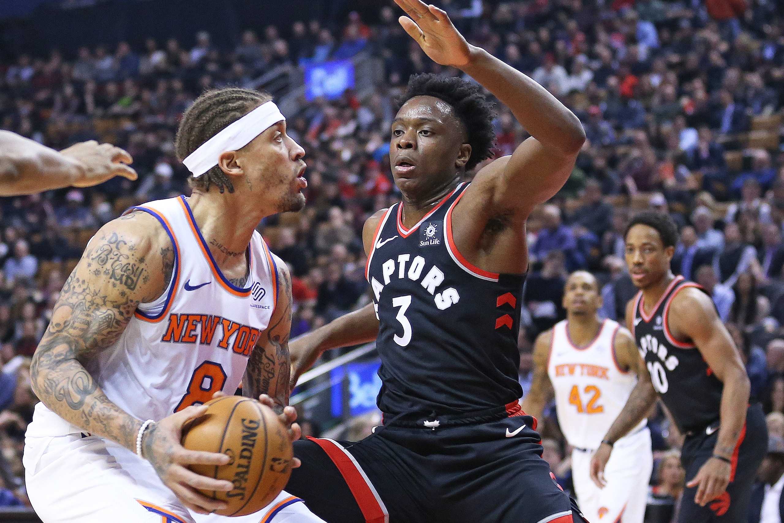 TORONTO, ON - FEBRUARY 8: Michael Beasley #8 of the New York Knicks is guarded closely by OG Anunoby #3 of the Toronto Raptors in an NBA game at the Air Canada Centre on February 8, 2018 in Toronto, Ontario, Canada. The Raptors defeated the Knicks 113-88 TORONTO, ON - FEBRUARY 8: Michael Beasley #8 of the New York Knicks is guarded closely by OG Anunoby #3 of the Toronto Raptors in an NBA game at the Air Canada Centre on February 8, 2018 in Toronto, Ontario, Canada. The Raptors defeated the Knicks 113-88