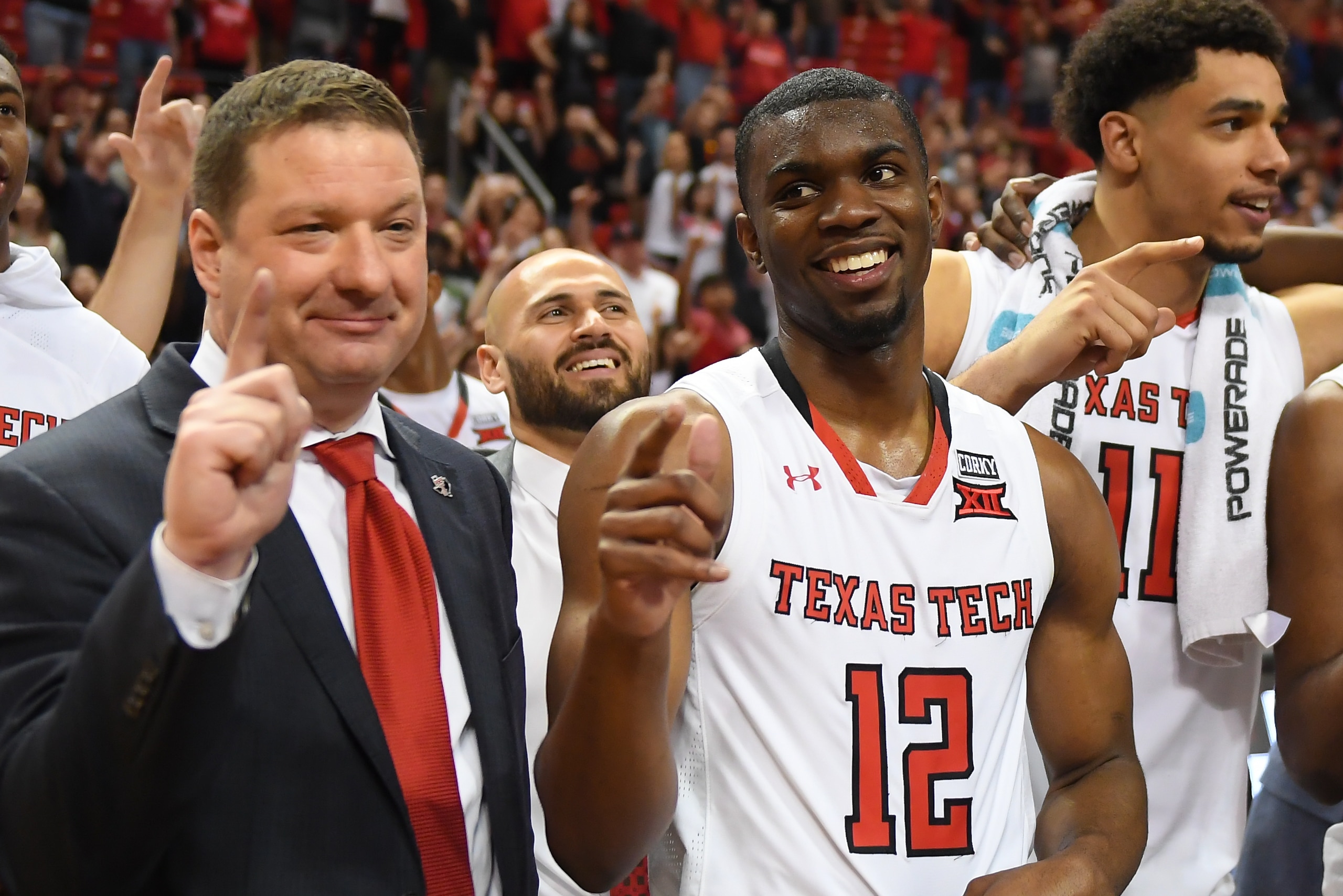 LUBBOCK, TX - MARCH 3: Head coach Chris Beard and Keenan Evans #12 of the Texas Tech Red Raiders stand on the court after the game against the TCU Horned Frogs on March 3, 2018 at United Supermarket Arena in Lubbock, Texas. Texas Tech defeated TCU 79-75. 