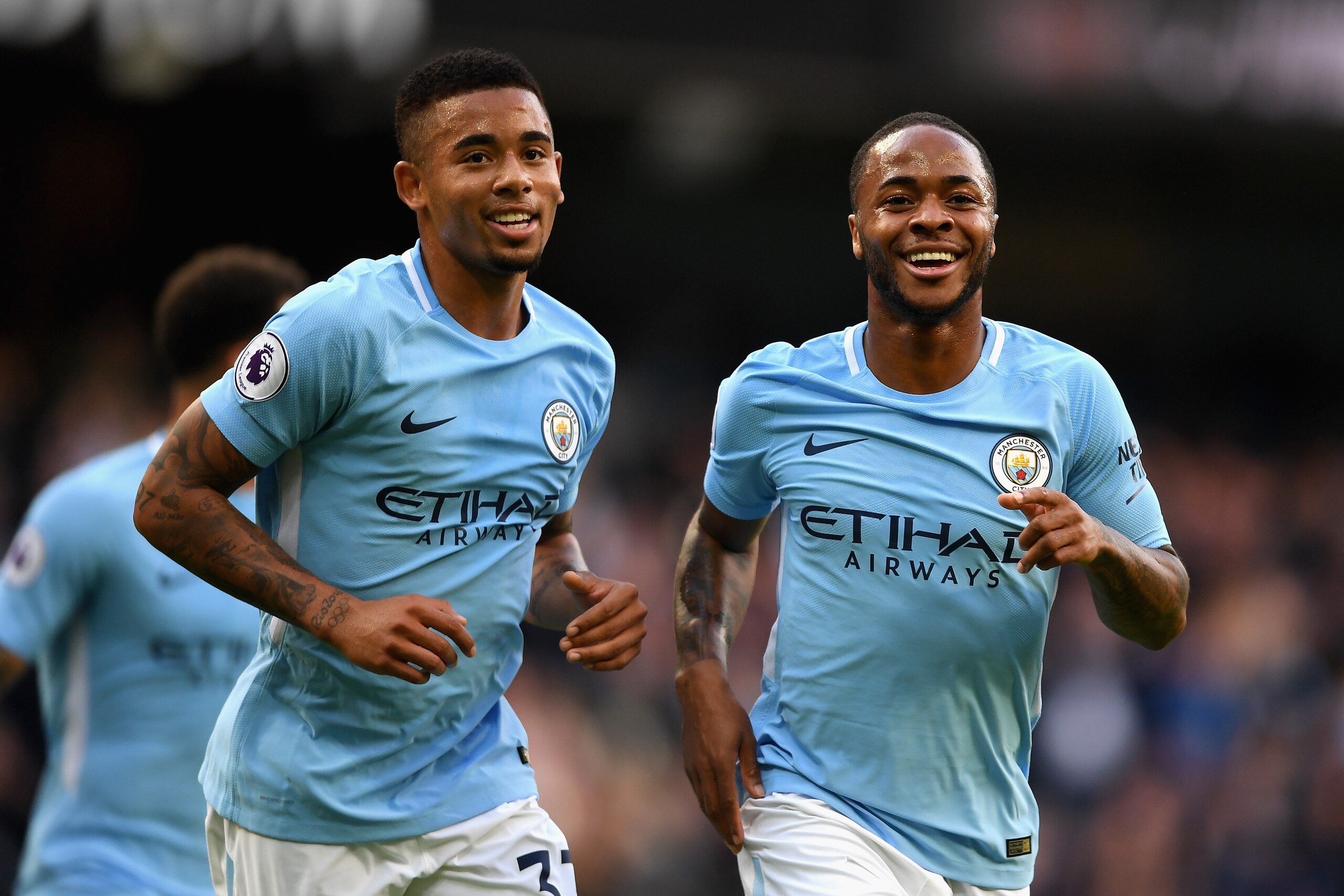 MANCHESTER, ENGLAND - OCTOBER 14:  Raheem Sterling of Manchester City celebrates scoring his sides second goal with Gabriel Jesus of Manchester City during the Premier League match between Manchester City and Stoke City at Etihad Stadium on October 14, 20