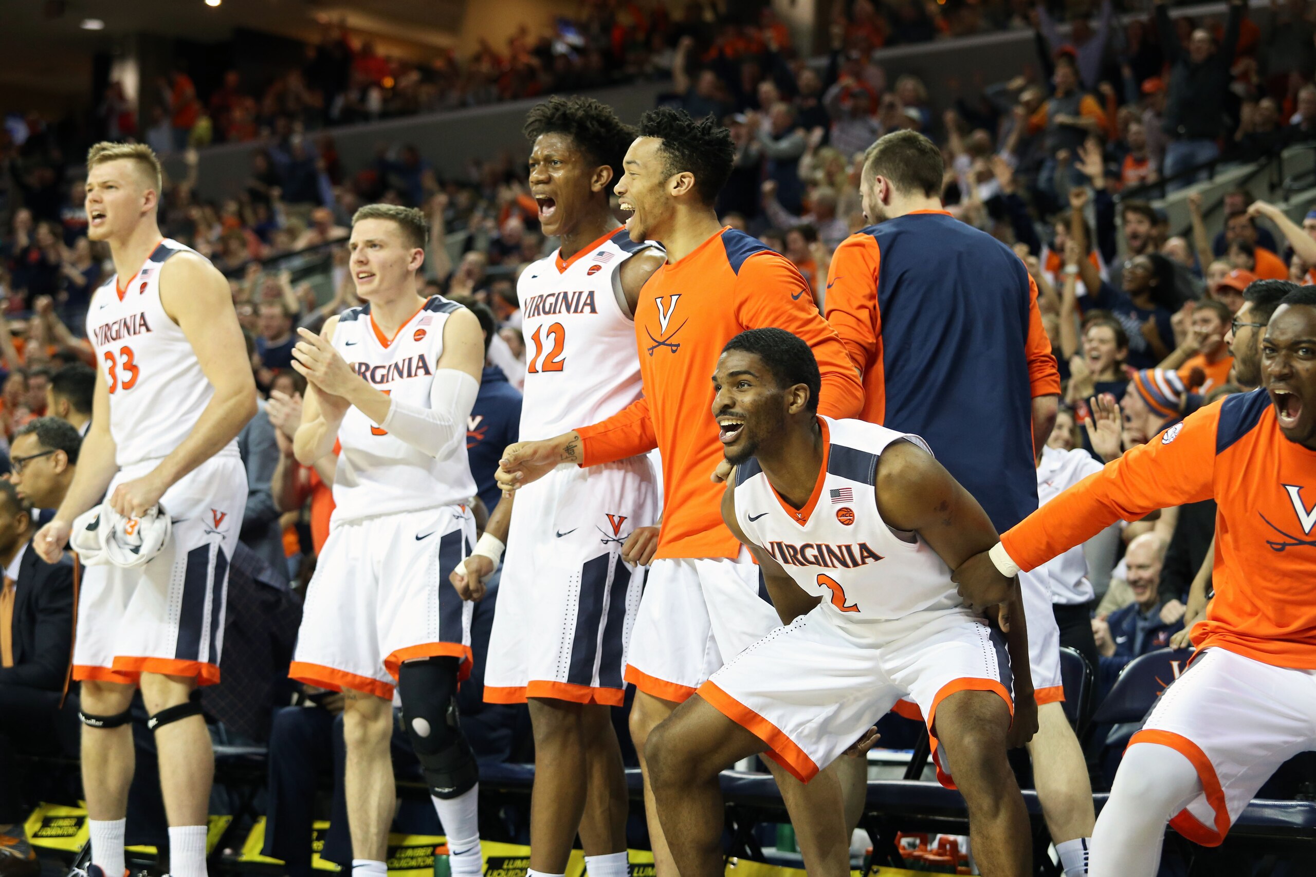 CHARLOTTESVILLE, VA - MARCH 3: Justice Bartley #2 of the Virginia Cavaliers and the rest of the bench cheers in the second half during a game against the Notre Dame Fighting Irish at John Paul Jones Arena on March 3, 2018 in Charlottesville, Virginia. Vir
