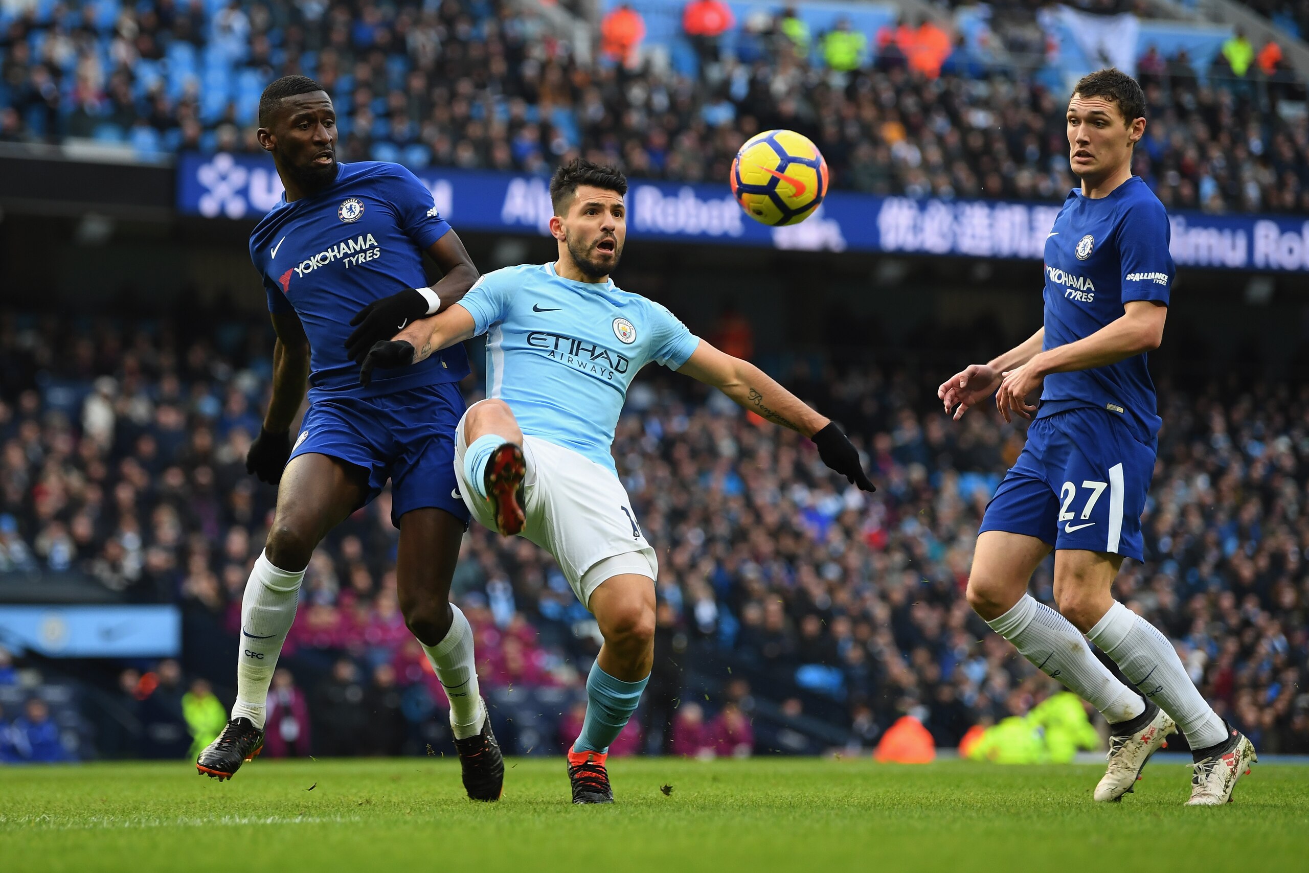 MANCHESTER, ENGLAND - MARCH 04:  Antonio Rudiger of Chelsea and Sergio Aguero of Manchester City battle for the ball as Andreas Christensen of Chelsea looks on during the Premier League match between Manchester City and Chelsea at Etihad Stadium on March 