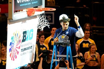 NEW YORK, NY - MARCH 04: Isaiah Livers #4 of the Michigan Wolverine cuts down the net after a win over the Purdue Boilermakers in the championship game of the Big Ten Basketball Tournament at Madison Square Garden on March 4, 2018 in New York City. The Mi