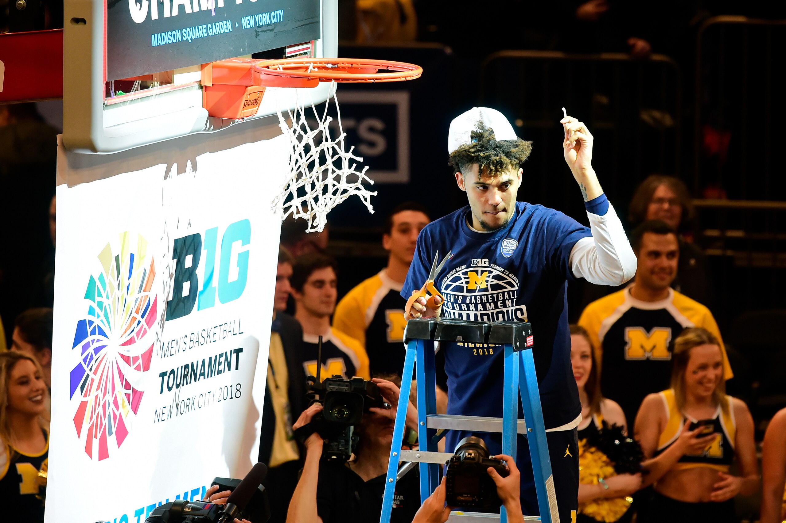 NEW YORK, NY - MARCH 04: Isaiah Livers #4 of the Michigan Wolverine cuts down the net after a win over the Purdue Boilermakers in the championship game of the Big Ten Basketball Tournament at Madison Square Garden on March 4, 2018 in New York City. The Mi