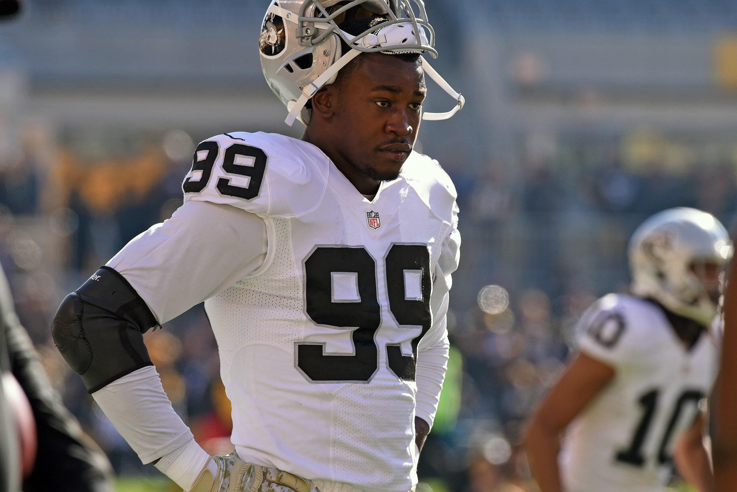 PITTSBURGH, PA - NOVEMBER 8:  Linebacker Aldon Smith #99 of the Oakland Raiders looks on from the field before a game against the Pittsburgh Steelers at Heinz Field on November 8, 2015 in Pittsburgh, Pennsylvania. The Steelers defeated the Raiders 38-35. 