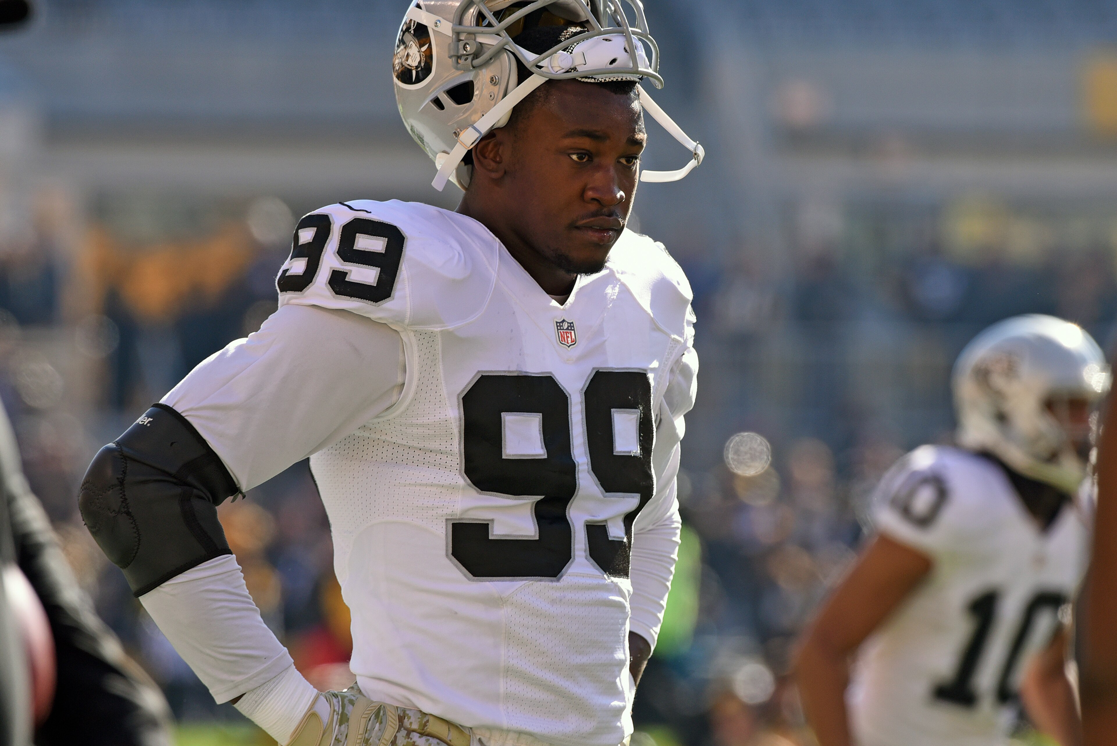 PITTSBURGH, PA - NOVEMBER 8: Linebacker Aldon Smith #99 of the Oakland Raiders looks on from the field before a game against the Pittsburgh Steelers at Heinz Field on November 8, 2015 in Pittsburgh, Pennsylvania. The Steelers defeated the Raiders 38-35. PITTSBURGH, PA - NOVEMBER 8: Linebacker Aldon Smith #99 of the Oakland Raiders looks on from the field before a game against the Pittsburgh Steelers at Heinz Field on November 8, 2015 in Pittsburgh, Pennsylvania. The Steelers defeated the Raiders 38-35.