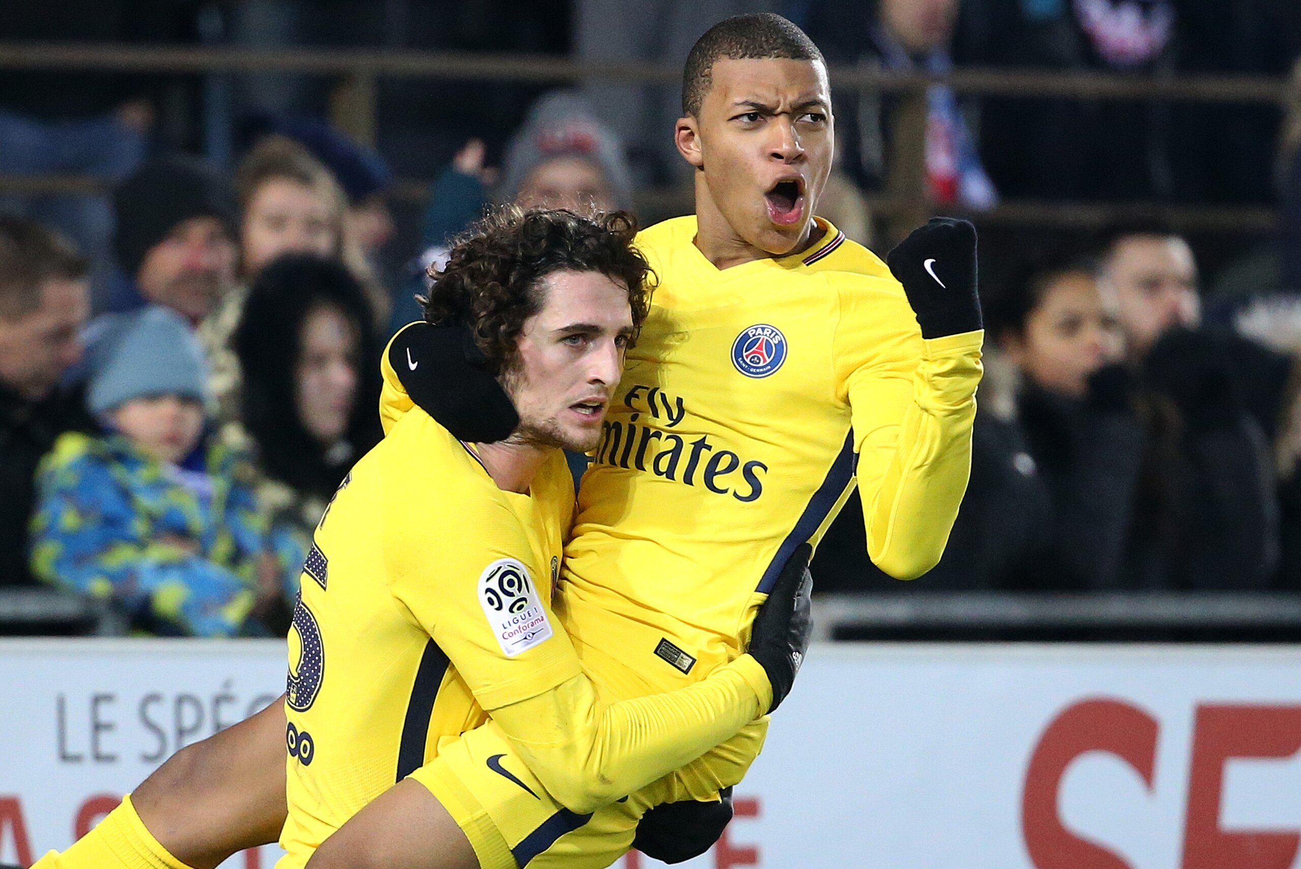 STRASBOURG, FRANCE - DECEMBER 2: Kylian Mbappe of PSG celebrates his goal with Adrien Rabiot (left) during the French Ligue 1 match between RC Strasbourg Alsace and Paris Saint Germain (PSG) at Stade de la Meinau on December 2, 2017 in Strasbourg, France.