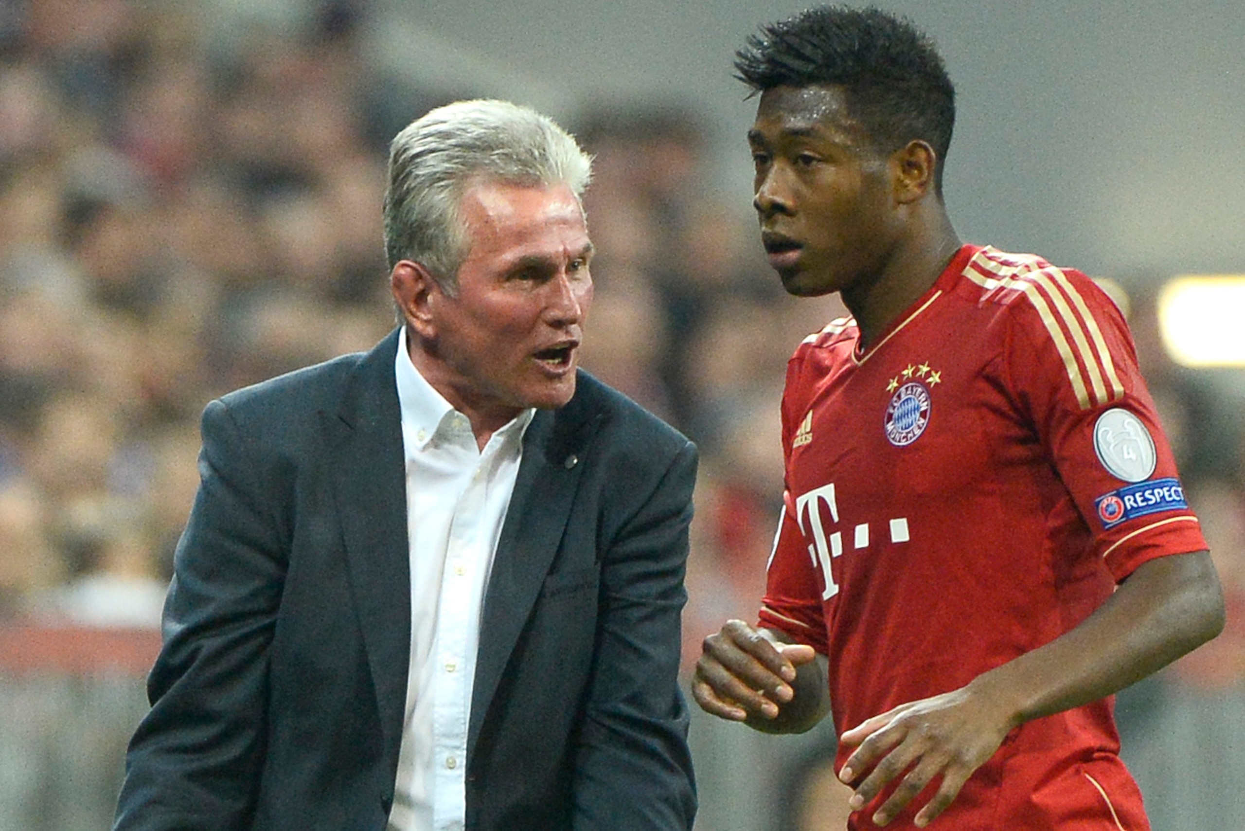 Bayern Munich's head coach Jupp Heynckes (L) chats with Bayern Munich's Austrian midfielder David Alaba during the UEFA champions league semi final first leg football match FC Bayern Muenchen vs FC Barcelona on April 23, 2013 in Munich, southern Germany. 