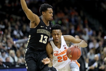 NEW YORK, NY - MARCH 06: Tyus Battle (25) of the Syracuse Orange works against Bryant Crawford (13) of the Wake Forest Demon Deacons in the second half during the first round of the ACC Men's Basketball Tournament at Barclays Center on March 6, 2018 in Ne