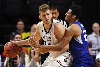 LAS VEGAS, NV - MARCH 05:  Jock Landale #34 of the Saint Mary's Gaels is guarded by Yoeli Childs #23 of the Brigham Young Cougars during a semifinal game of the West Coast Conference basketball tournament at the Orleans Arena on March 5, 2018 in Las Vegas