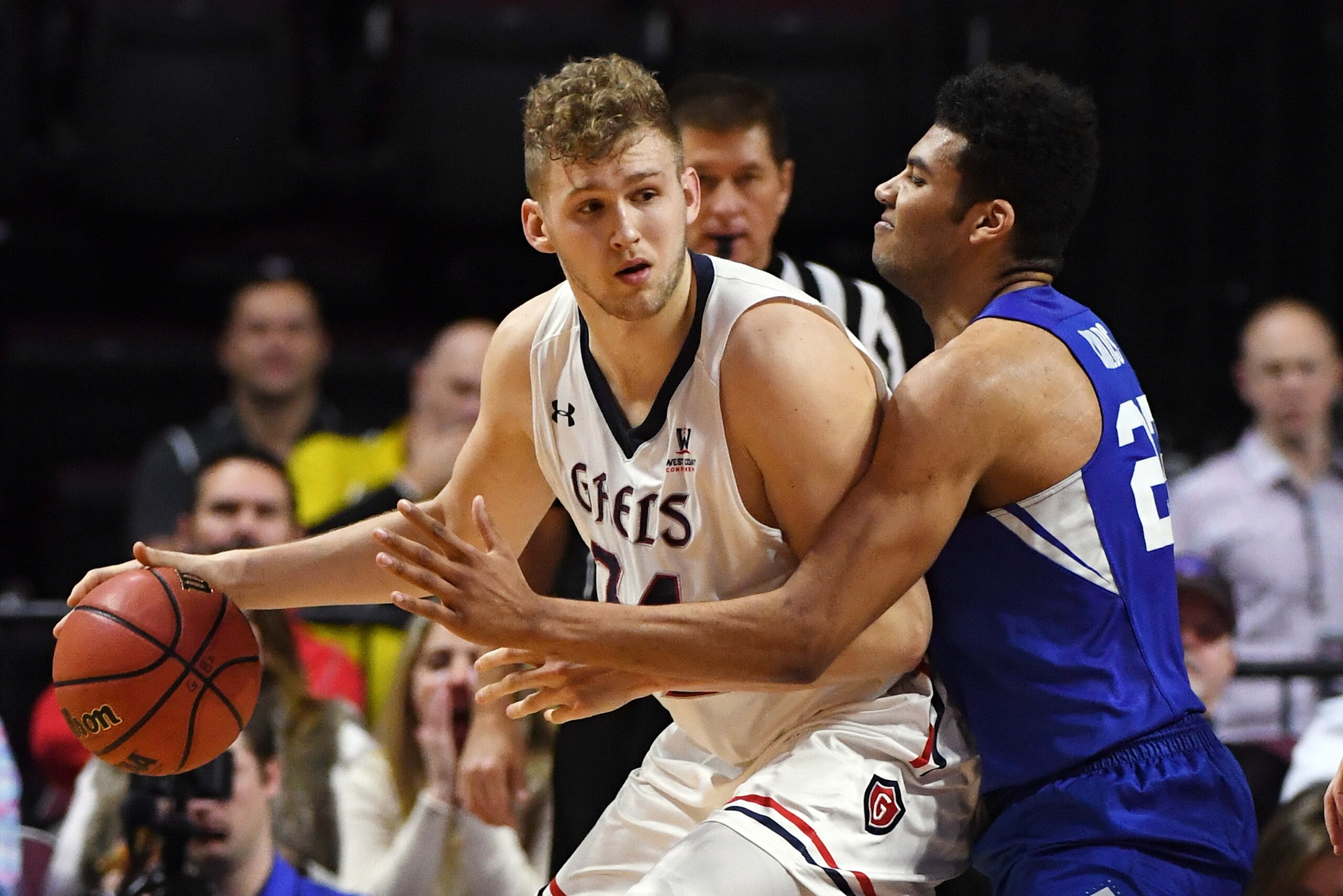LAS VEGAS, NV - MARCH 05:  Jock Landale #34 of the Saint Mary's Gaels is guarded by Yoeli Childs #23 of the Brigham Young Cougars during a semifinal game of the West Coast Conference basketball tournament at the Orleans Arena on March 5, 2018 in Las Vegas