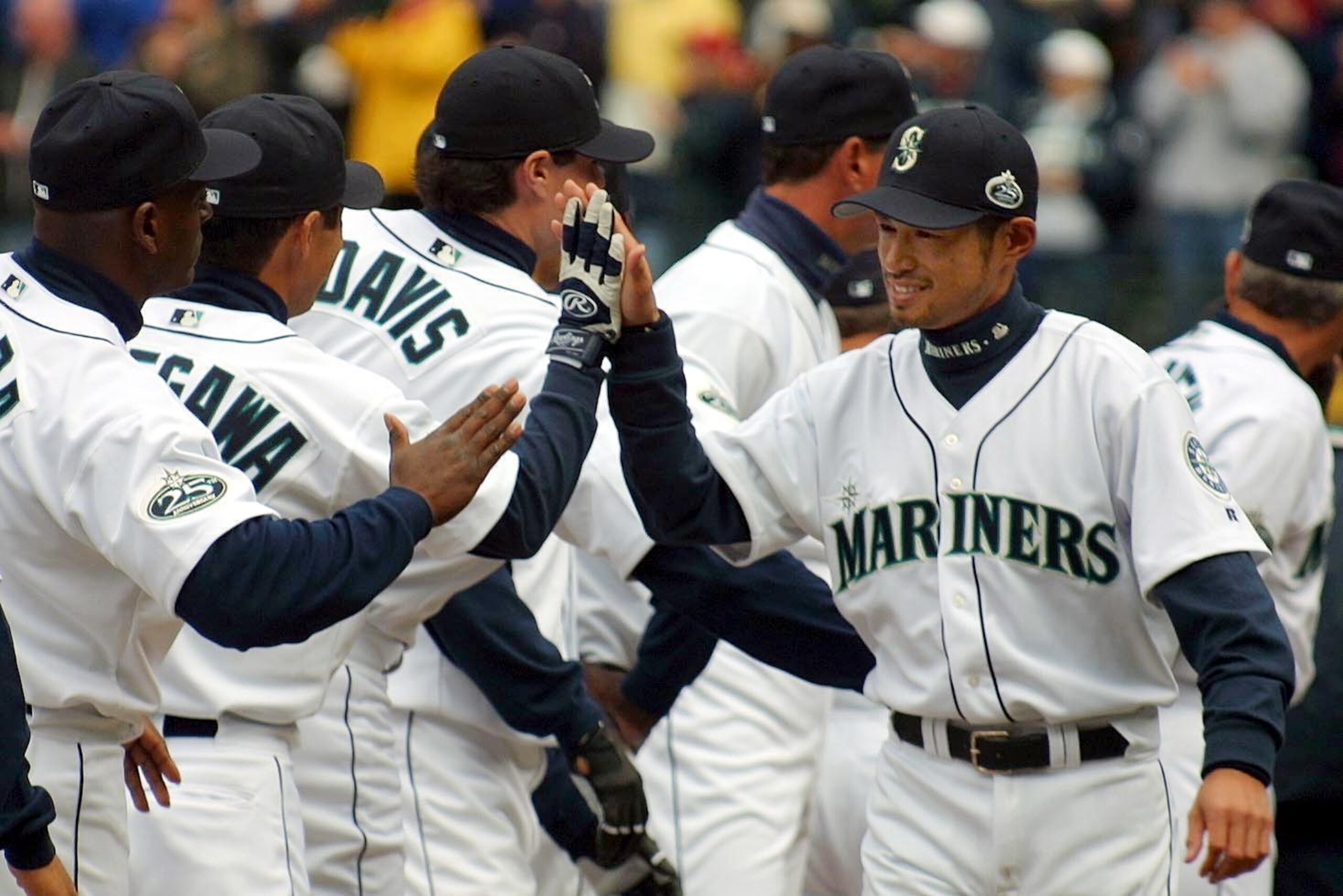 SEATTLE, UNITED STATES:  Seattle Mariners Ichiro Suzuki (R) is introduced during pre-game ceremonies before the Mariners game against the Chicago White Sox, in Seattle, 01 April 2002. Ichiro was selected the 2001 American League MVP and Rookie of the Year