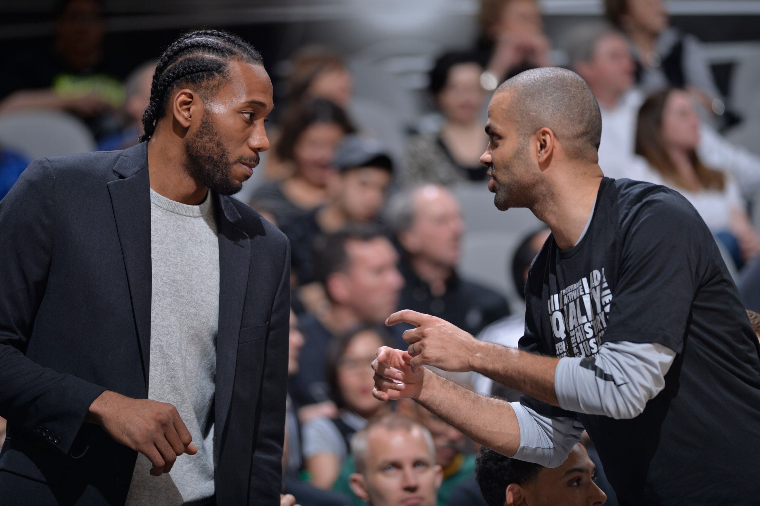 SAN ANTONIO, TX - FEBRUARY 28:  Kawhi Leonard #2 of the San Antonio Spurs talks with Tony Parker #9 of the San Antonio Spurs during the game against the New Orleans Pelicans on February 28, 2018 at the AT&T Center in San Antonio, Texas. NOTE TO USER: User