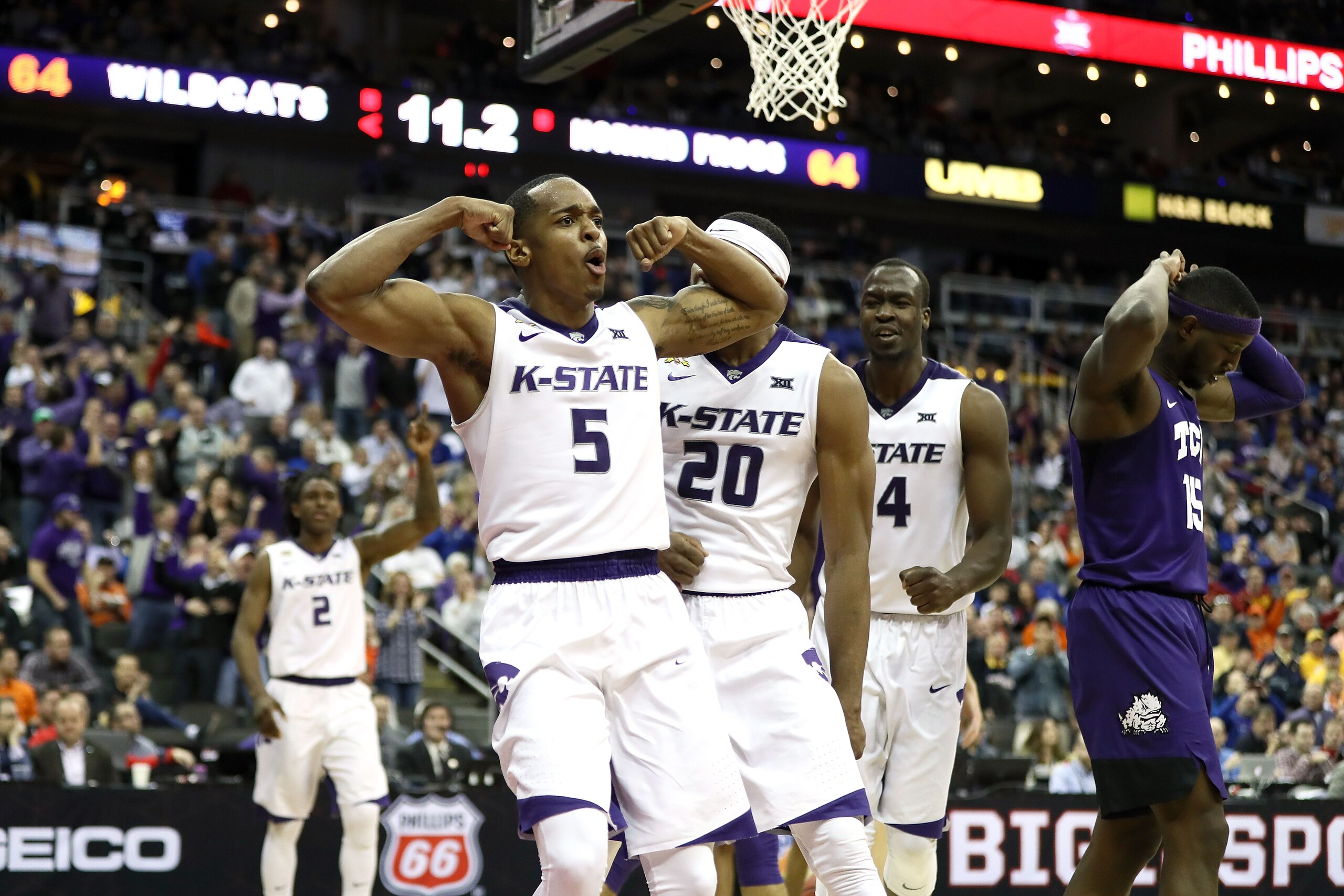 KANSAS CITY, MO - MARCH 08:  Barry Brown #5 of the Kansas State Wildcats celebrates after scoring in the final seconds of overtime during the Big 12 Basketball Tournament quarterfinal game against the TCU Horned Frogs at the Sprint Center on March 8, 2018